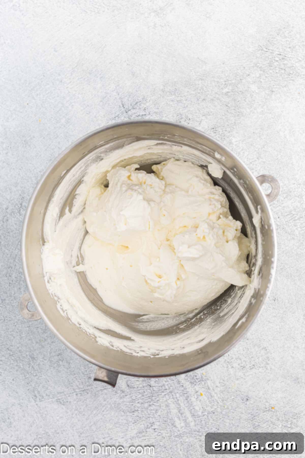 Fresh heavy whipping cream in a bowl, before being whipped to stiff peaks.