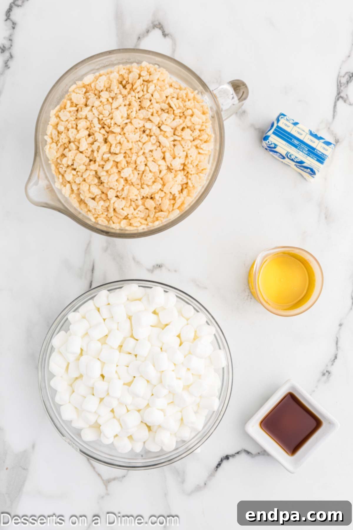 A visual display of the five simple ingredients needed for Starbucks marshmallow dream bars: corn syrup, unsalted butter, Rice Krispies cereal, mini marshmallows, and vanilla extract.