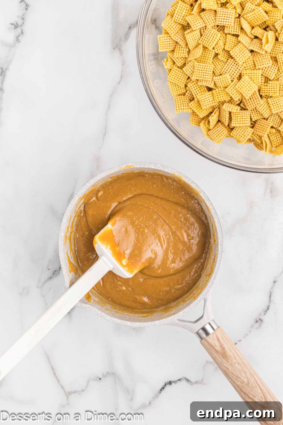 Chex Peanut Butterscotch Crunch 4 Saucepan containing melted peanut butter, corn syrup, and granulated sugar mixture.
