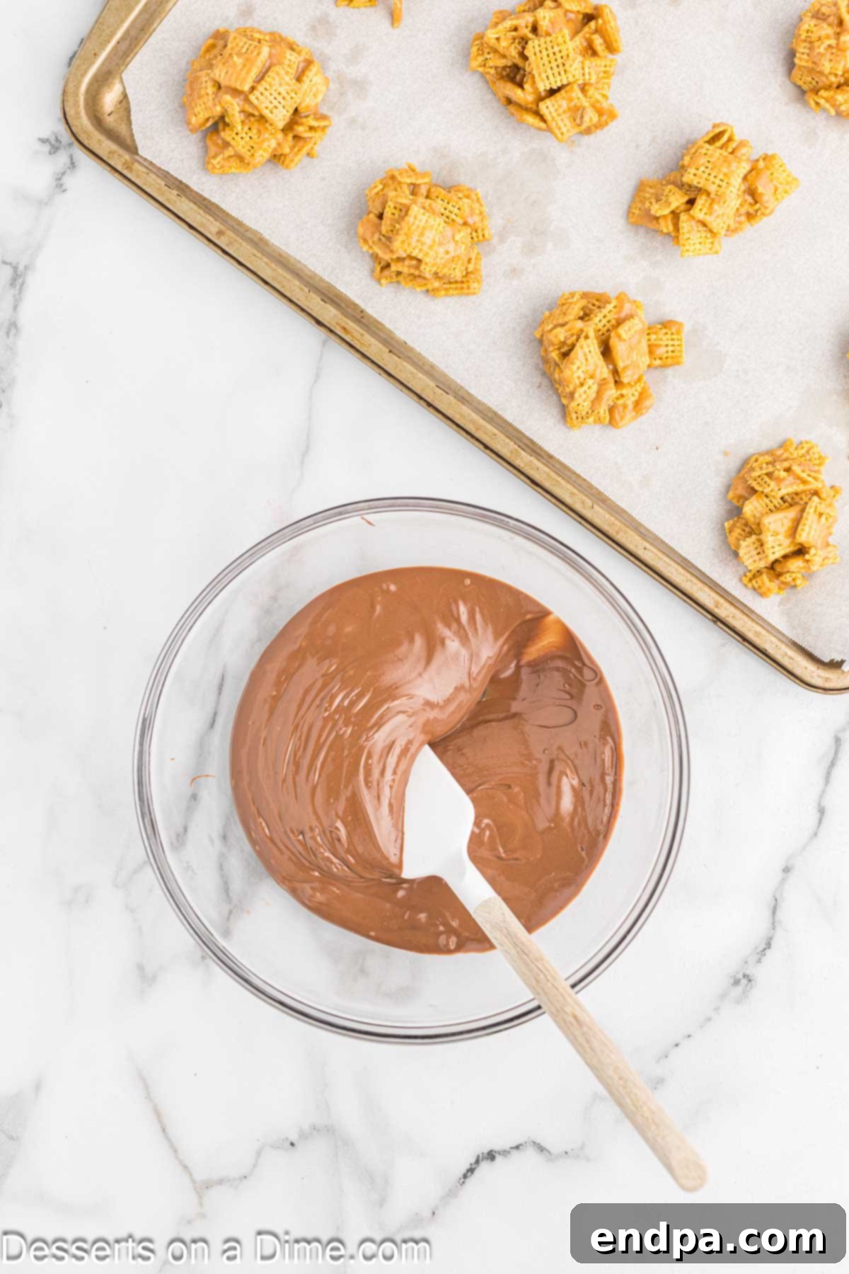 Chex Peanut Butterscotch Crunch 7 A microwave-safe bowl filled with melted chocolate and butterscotch chips, perfectly smooth and combined.