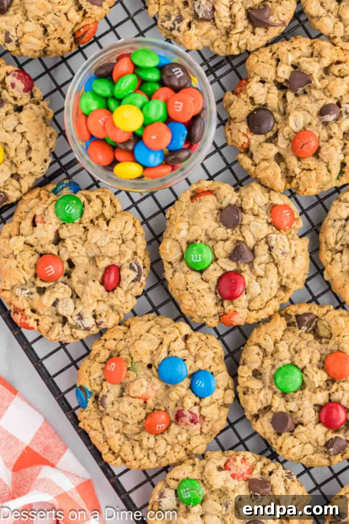 Baked Monster Cookies transferred to a wire rack for complete cooling.