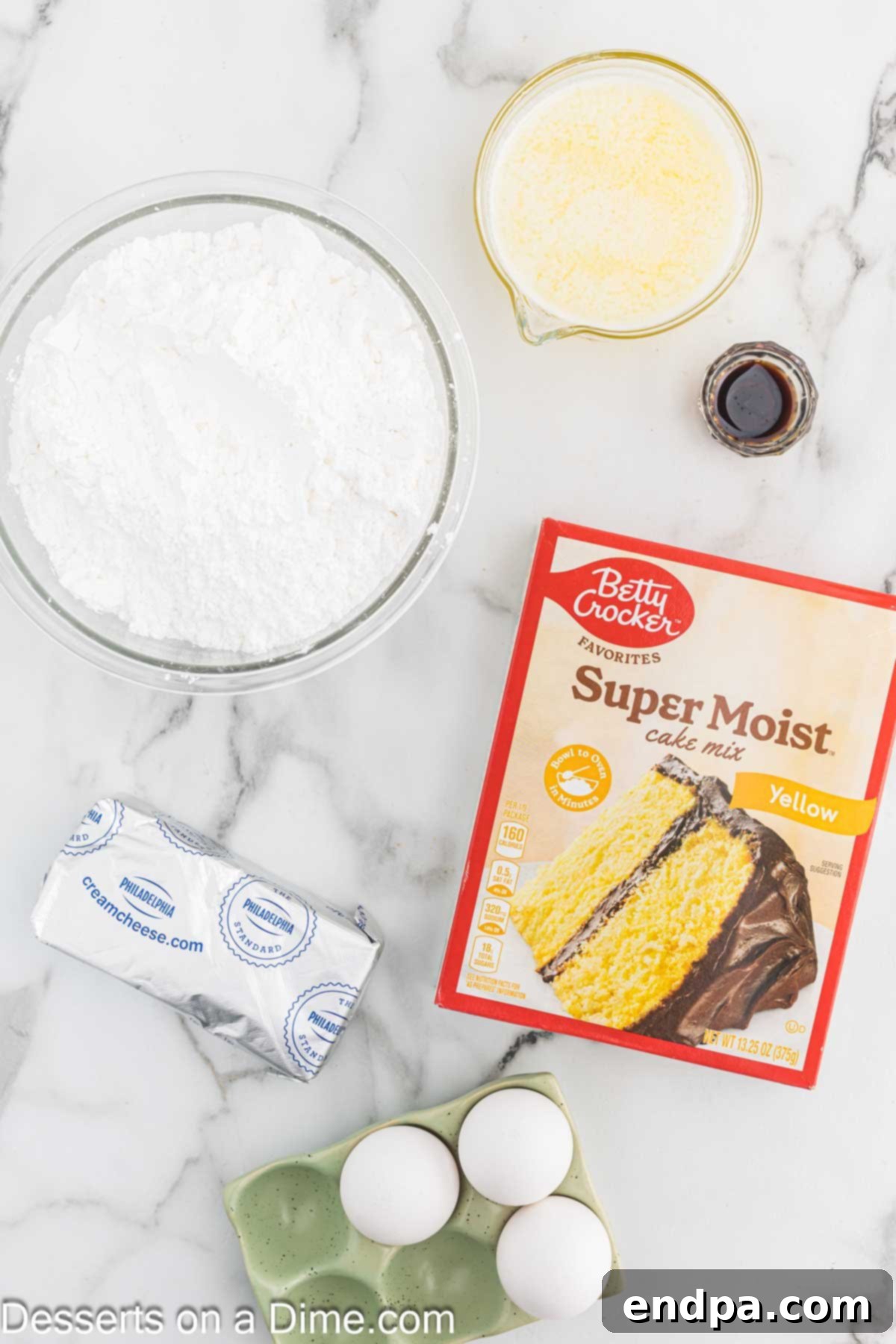 Ingredients for Ooey Gooey Bars - yellow cake mix, egg, butter, cream cheese, vanilla, powdered sugar laid out on a wooden surface.
