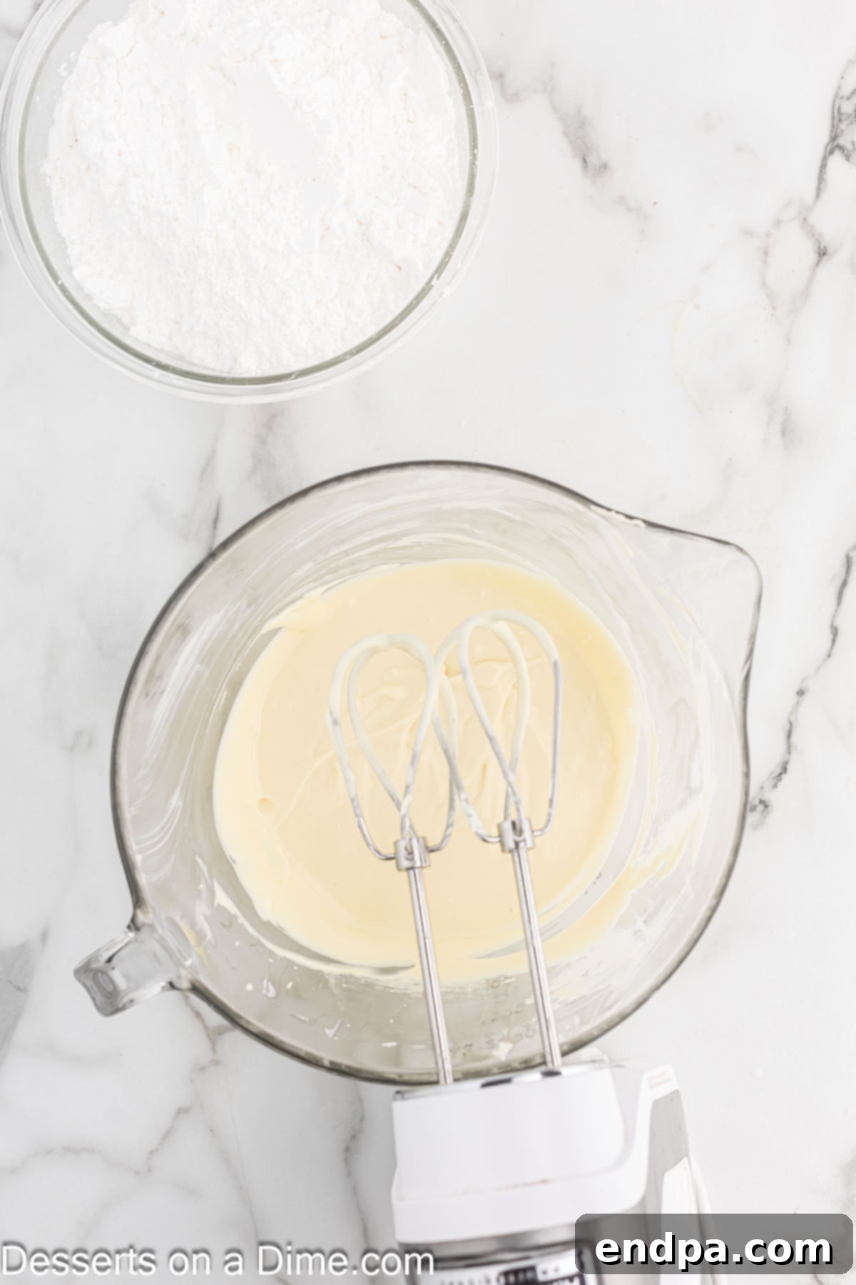 Melted butter, vanilla extract, and eggs being added to the smoothed cream cheese mixture in a bowl.