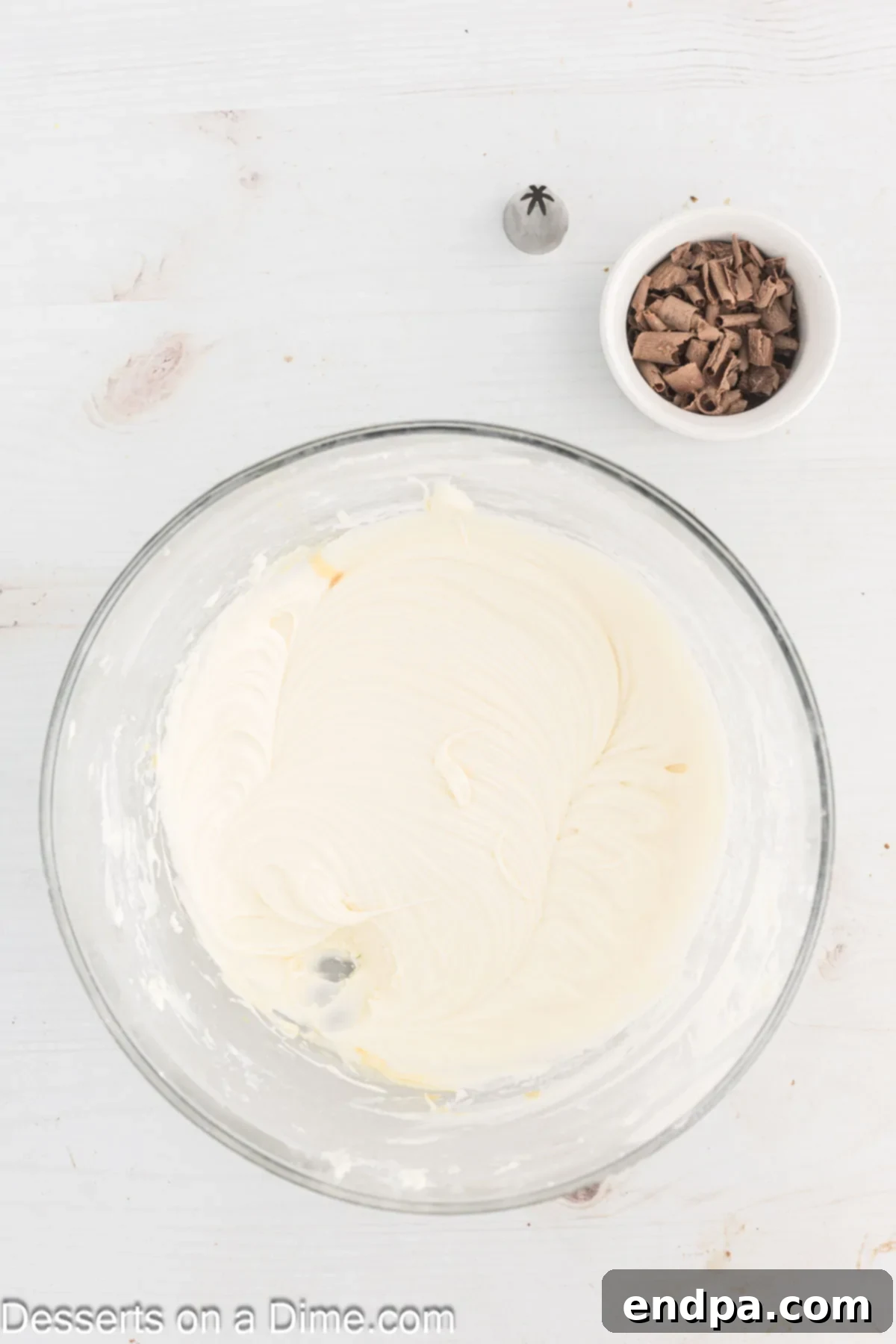 Smooth, fluffy Bailey's Irish Cream frosting in a mixing bowl, ready for piping.