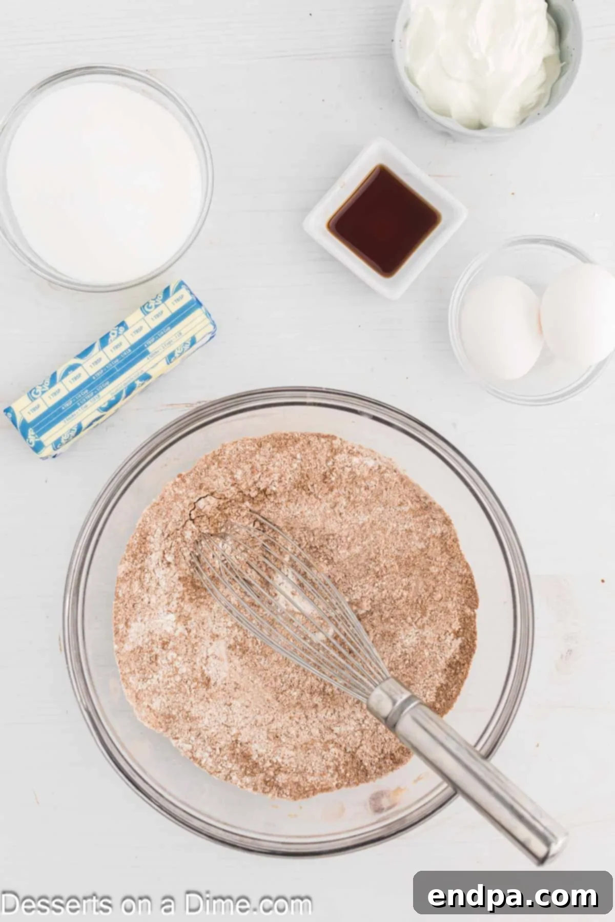 Mixing bowl with flour, cocoa powder, baking soda, and salt combined.