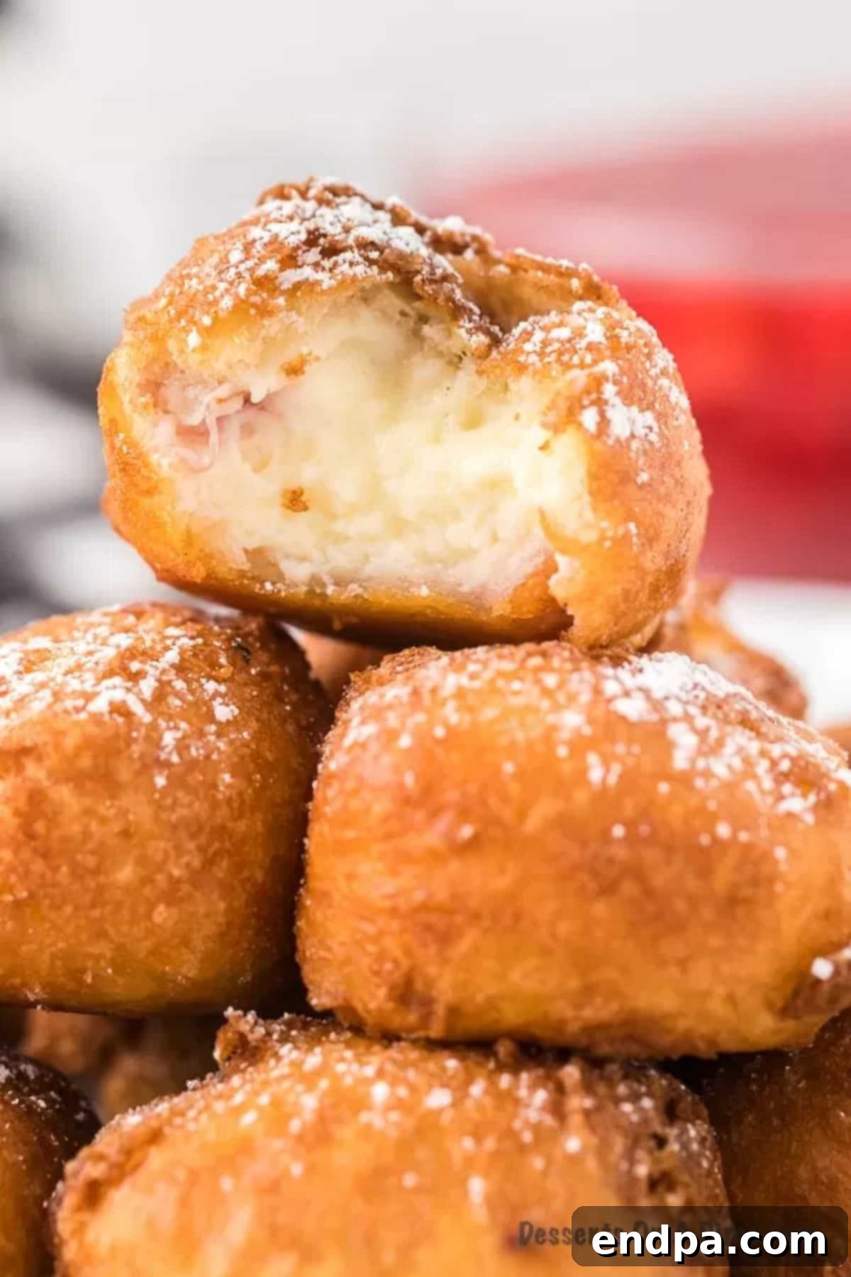 Crispy Cheesecake Indulgence 2 Close up image of golden-brown Deep Fried Cheesecake Bites stacked, ready to be served.