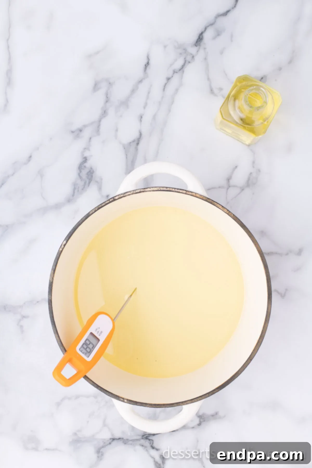 Crispy Cheesecake Indulgence 5 Deep pot with vegetable oil heating up to the correct temperature for frying.