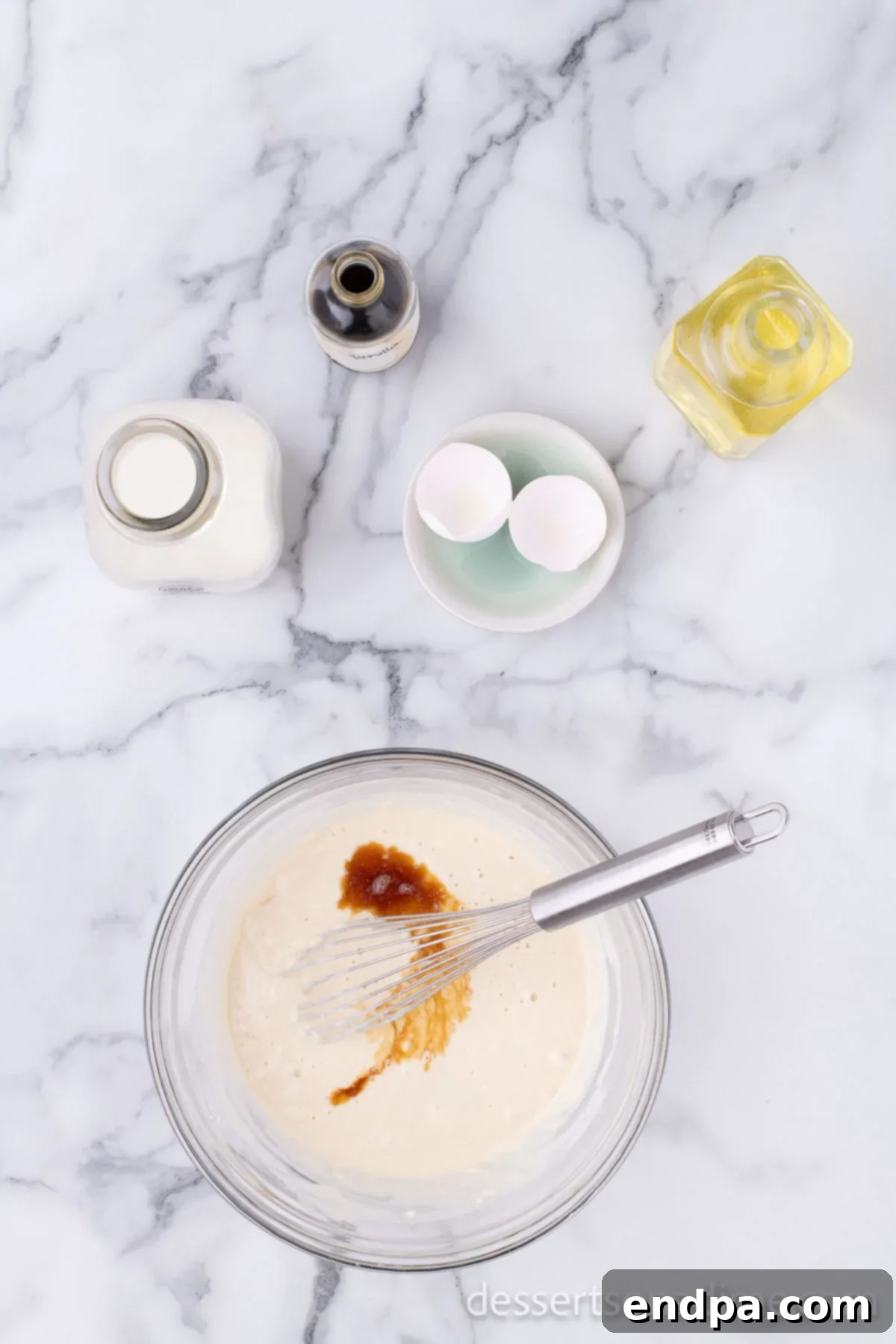 Crispy Cheesecake Indulgence 8 Pancake batter smoothly combined in a bowl, ready for dipping the cheesecake.