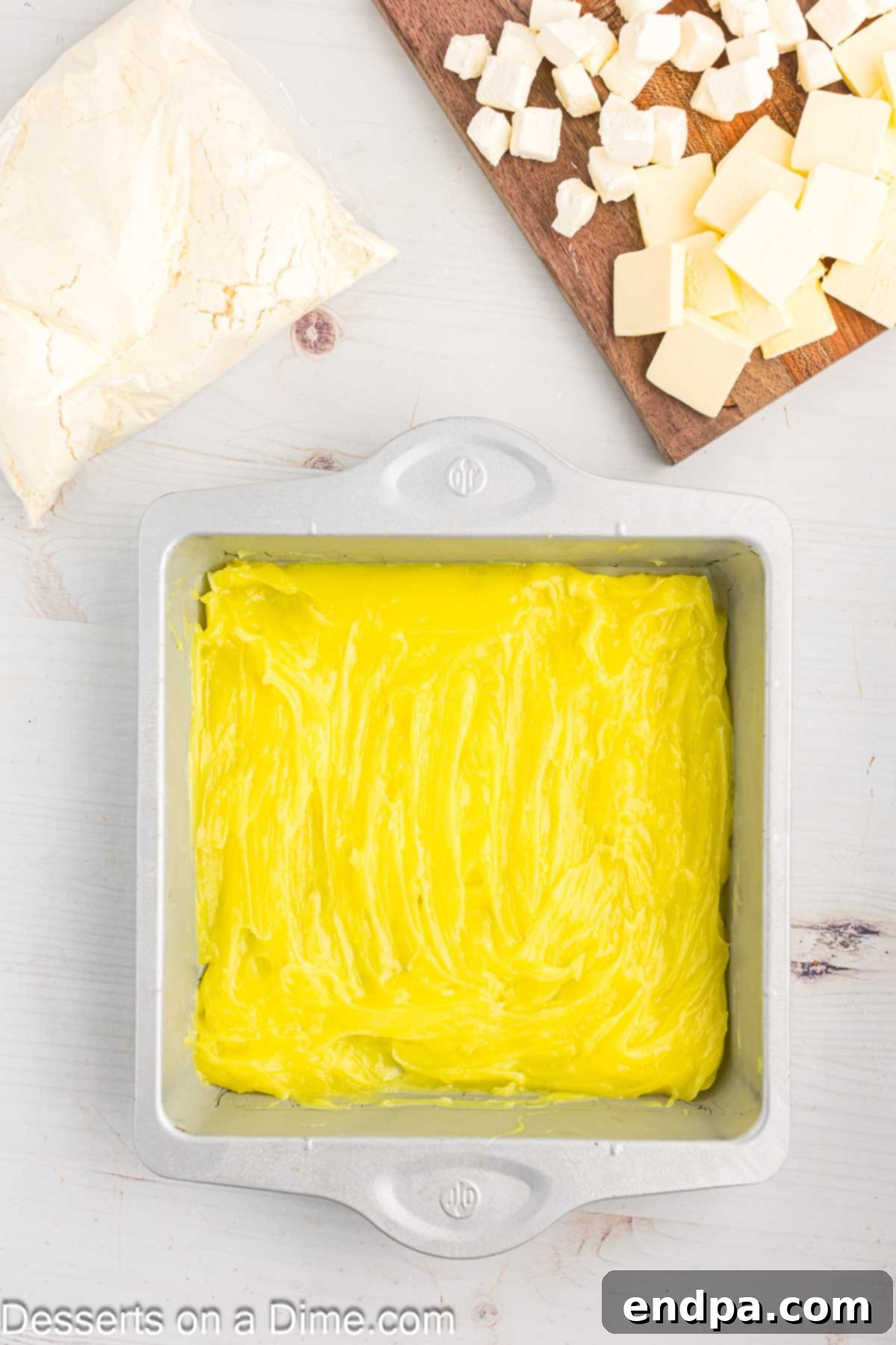 Zesty Lemon Easy Bake 5 Lemon pie filling evenly spread across the bottom of a glass baking pan.