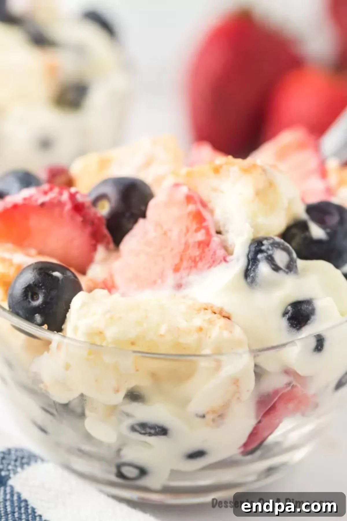 A smaller, individual serving of Red White and Blue Trifle in a glass bowl, showcasing its festive layers.