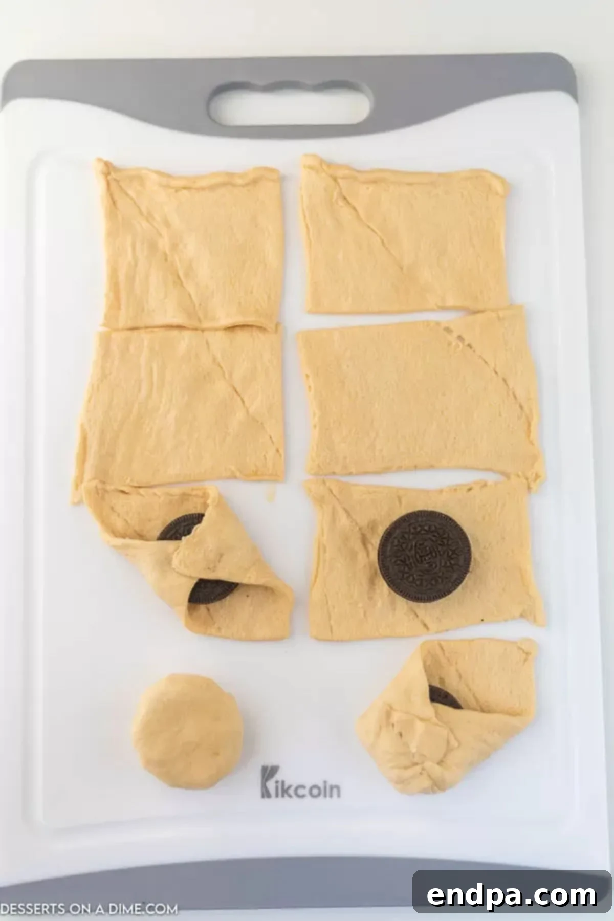 Air Fryer Oreo Magic 4 Crescents laid out and topped with oreo cookies.