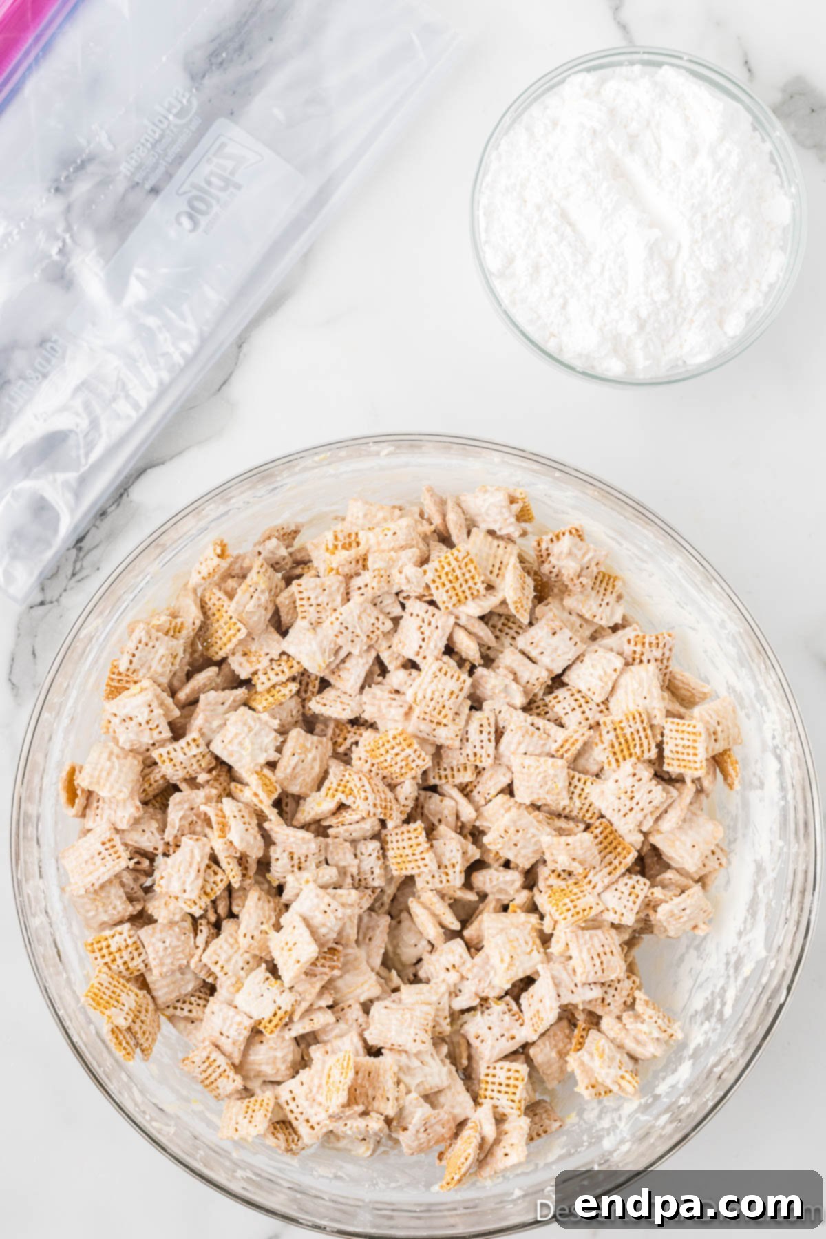 Chex cereal gently mixed with white chocolate coating.