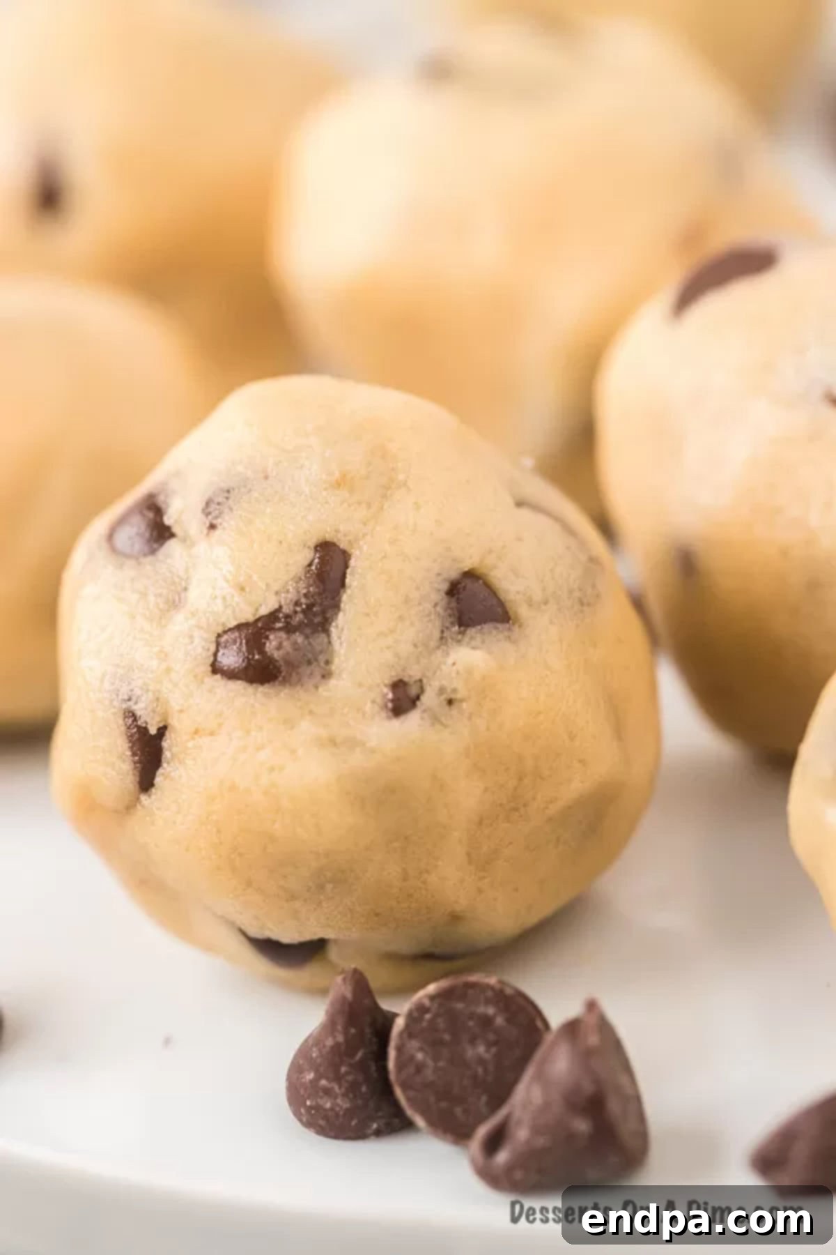 Ready-to-Eat Cookie Dough Dream 2 Delicious edible cookie dough balls on a decorative platter, ready to be enjoyed.