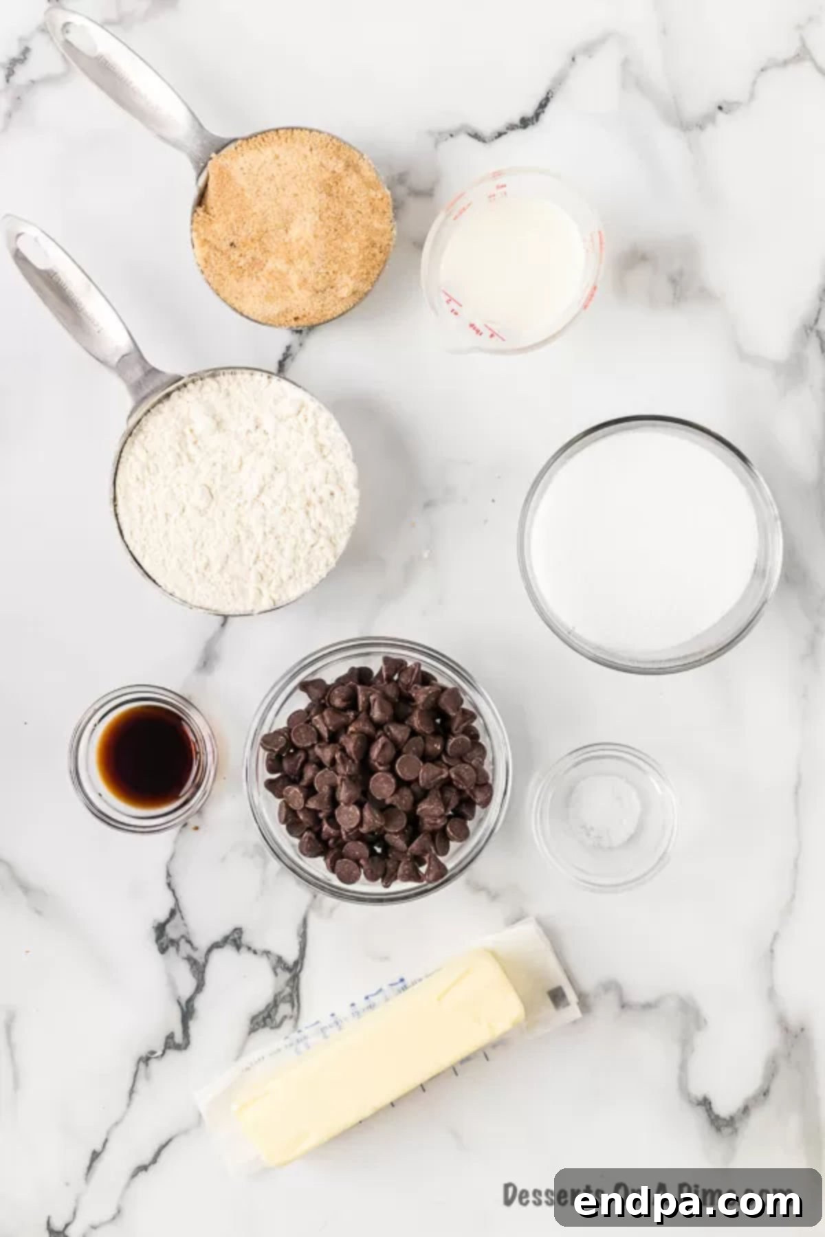 Ready-to-Eat Cookie Dough Dream 3 Individual ingredients for edible cookie dough laid out: flour, butter, brown sugar, granulated sugar, salt, milk, vanilla extract, and chocolate chips.