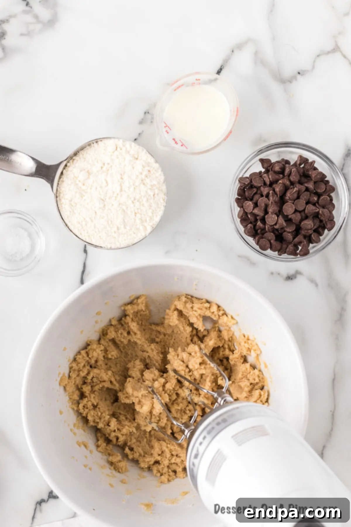 Ready-to-Eat Cookie Dough Dream 4 Softened butter, both brown and granulated sugars, and vanilla extract being combined in a large bowl with a hand mixer until light and fluffy.