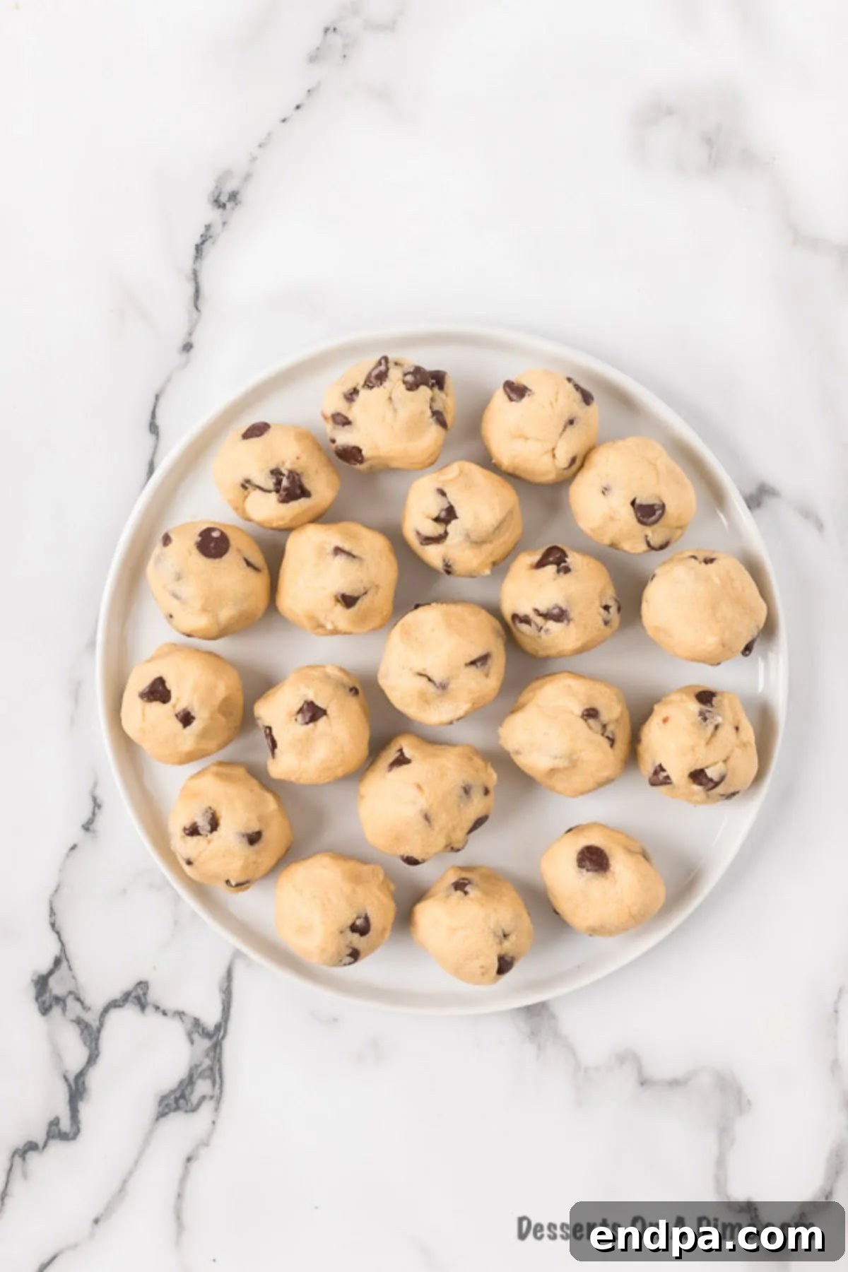 Ready-to-Eat Cookie Dough Dream 7 Finished edible cookie dough being rolled into perfect spheres and placed onto a serving platter.