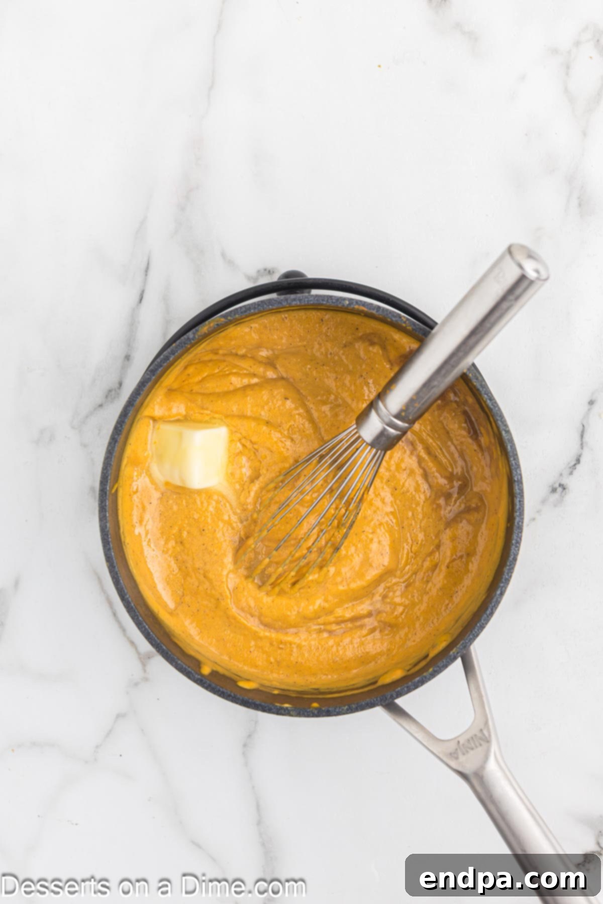 Spiced Pumpkin Dream 8 Tempered sugar and egg mixture being stirred back into the saucepan with the remaining pumpkin base.