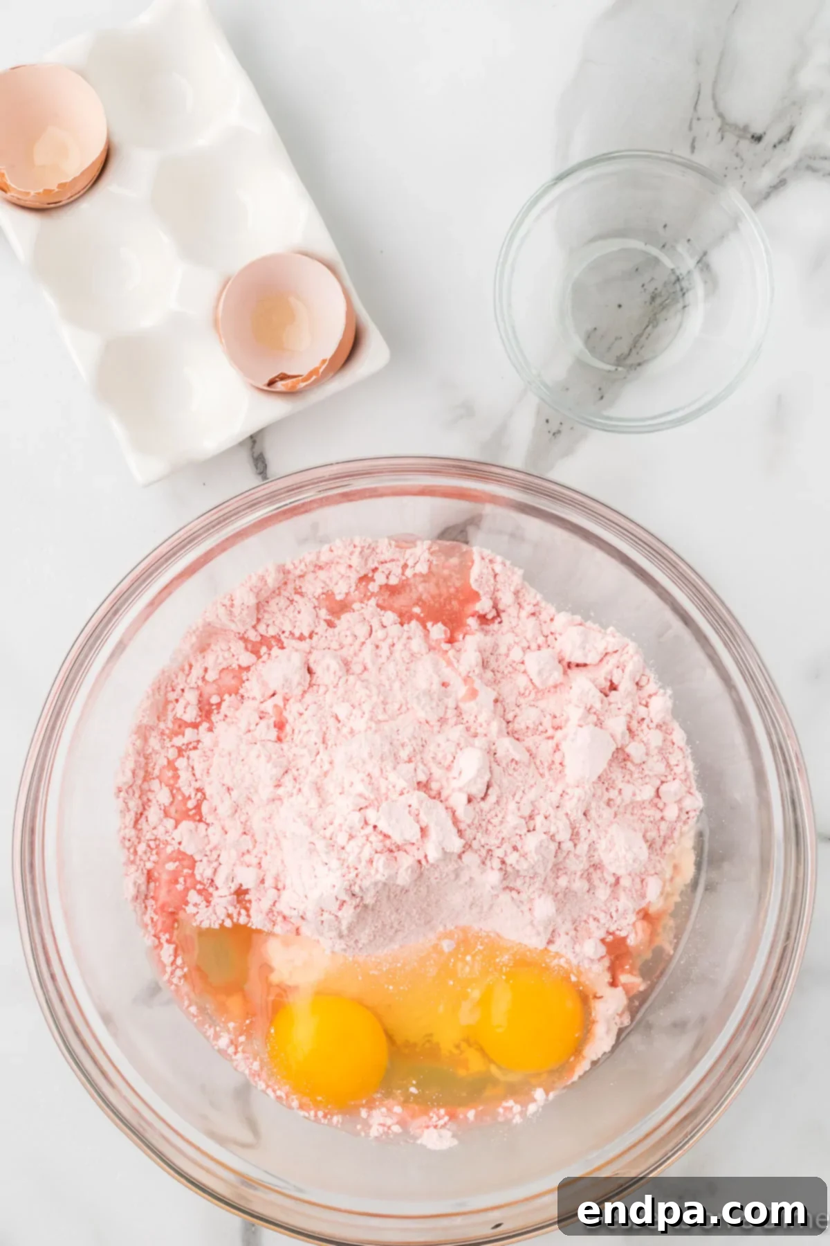 Mixing bowl with cake mix, eggs and oil. 