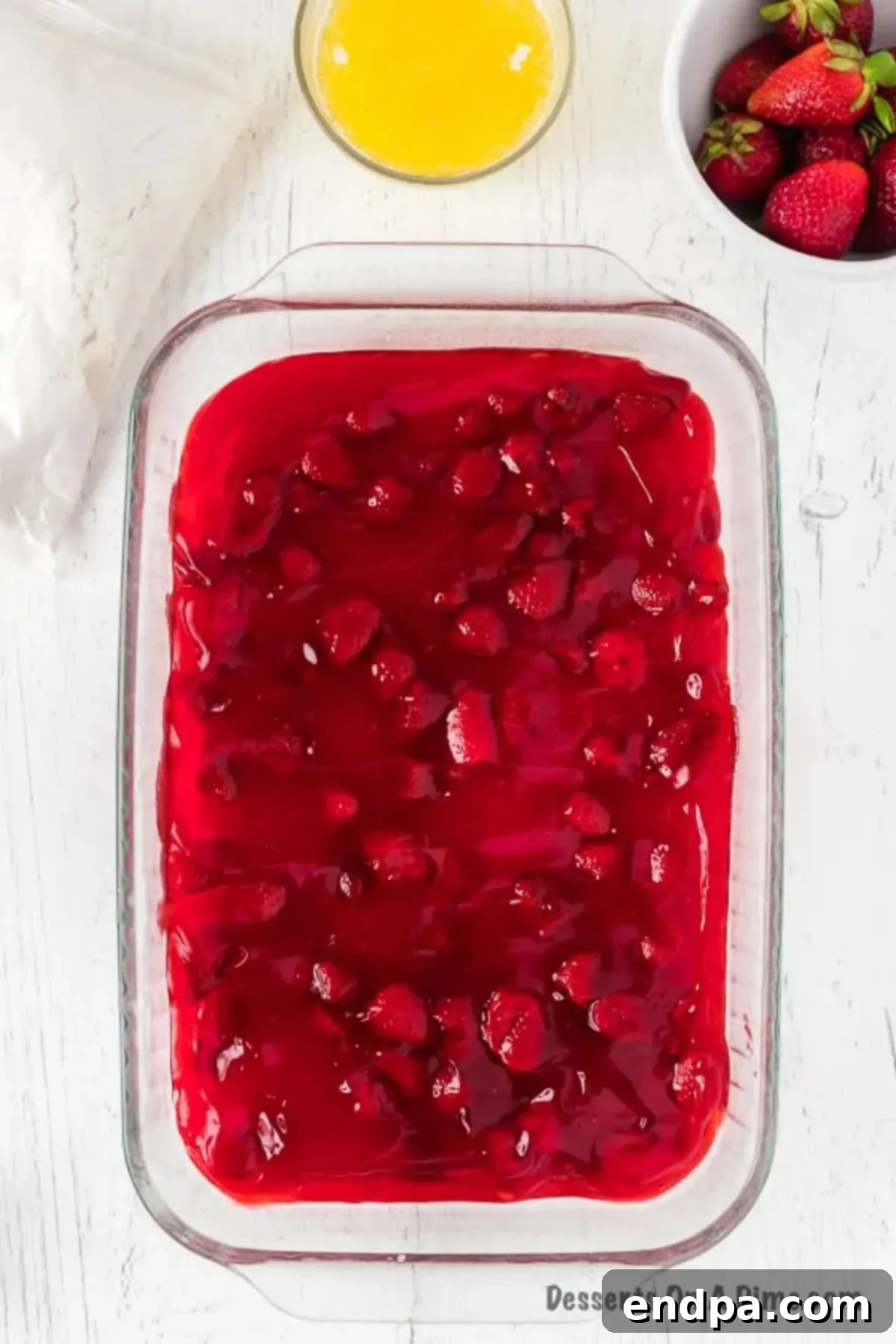 One-Pan Strawberry Bliss 4 Pie filling in baking dish.