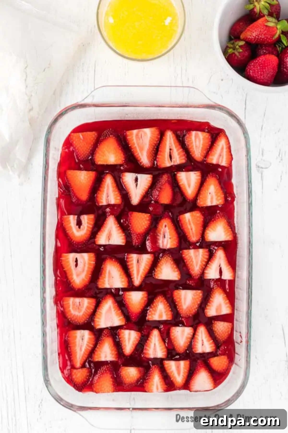 One-Pan Strawberry Bliss 5 Strawberries on top of pie filling.