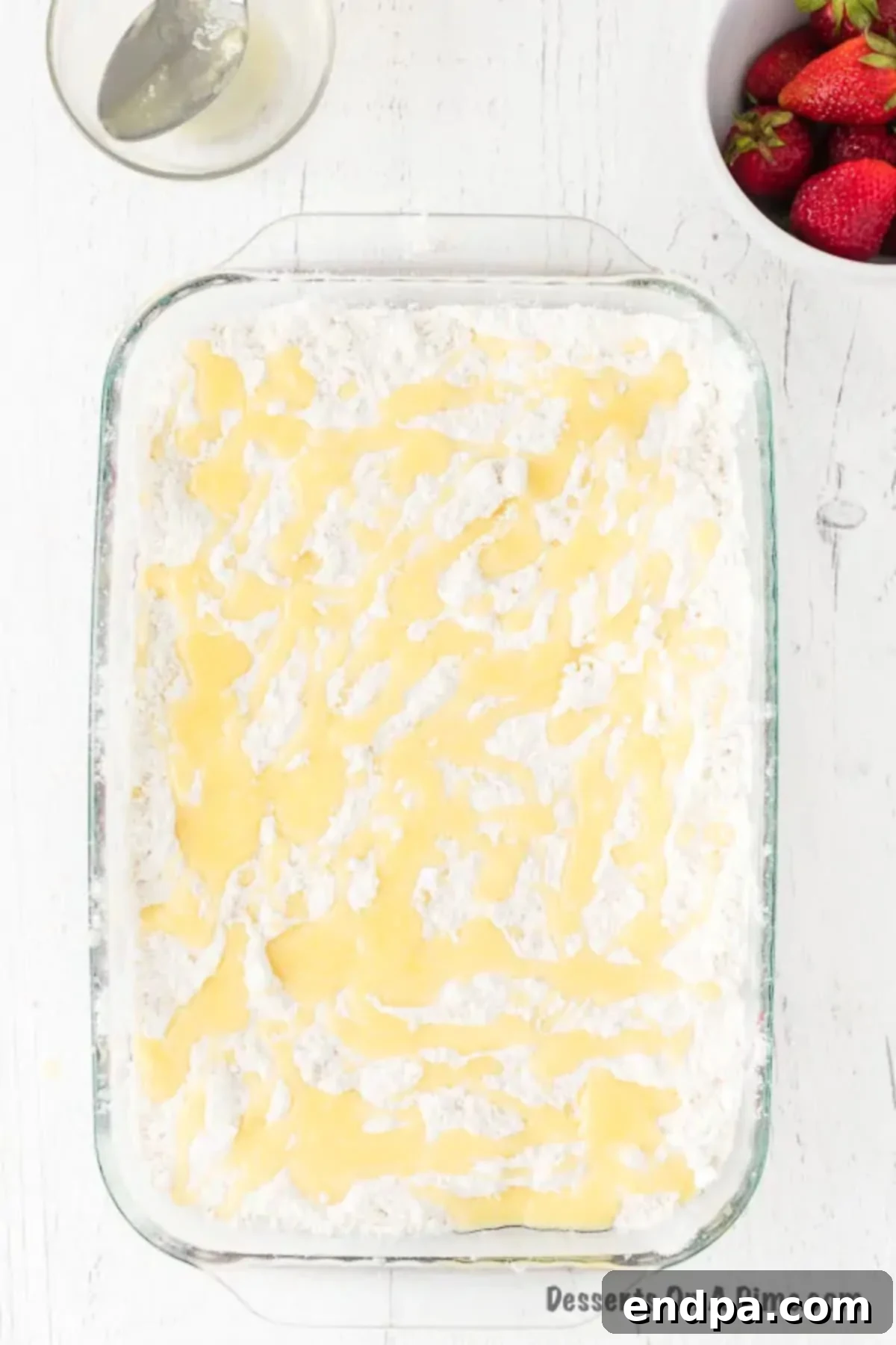 One-Pan Strawberry Bliss 7 Melted butter drizzled all over cake mix.