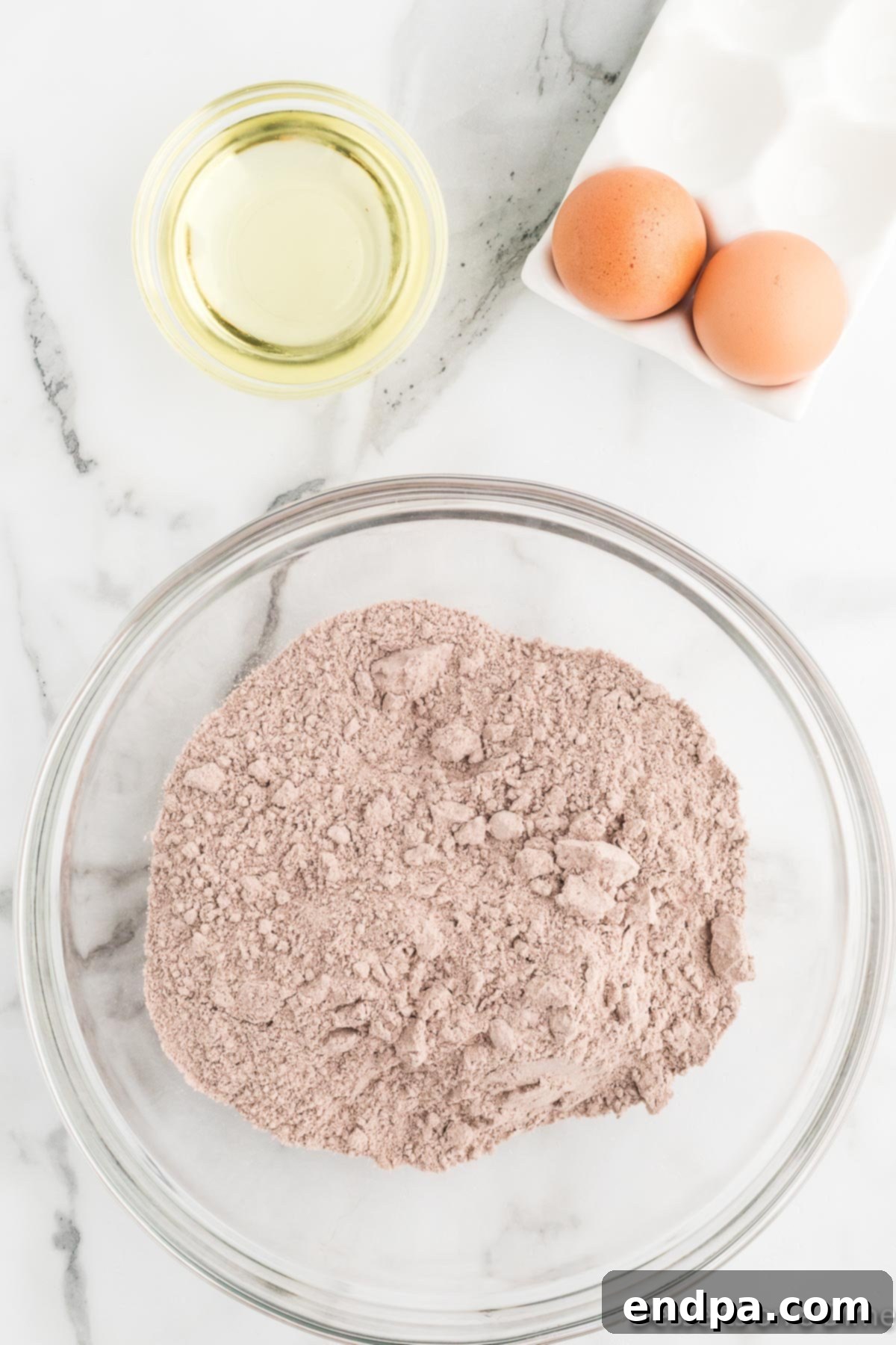 Cracked Cocoa Bliss 4 Dry chocolate cake mix in a large mixing bowl.