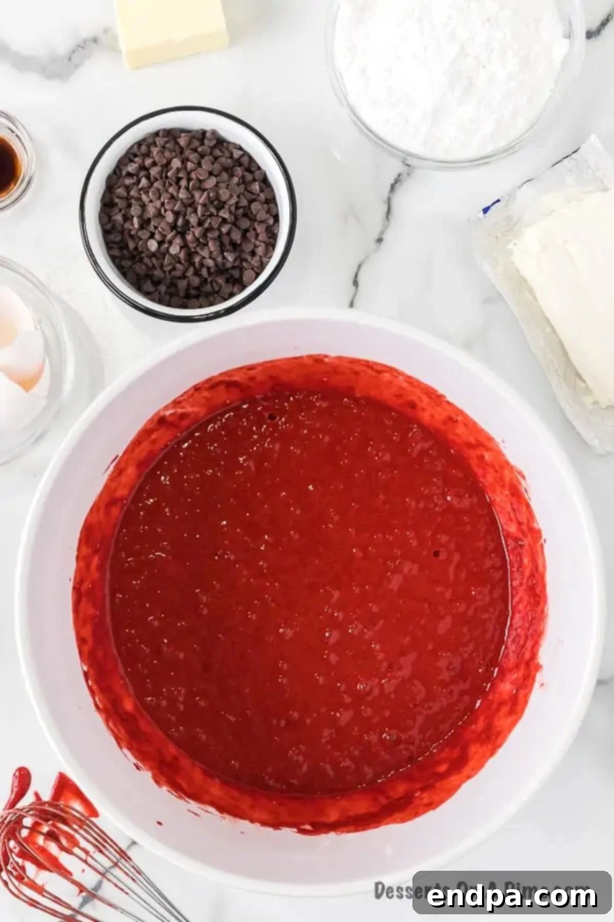 Red Velvet Infusion Cake 5 Mixing bowl with red velvet cake batter.
