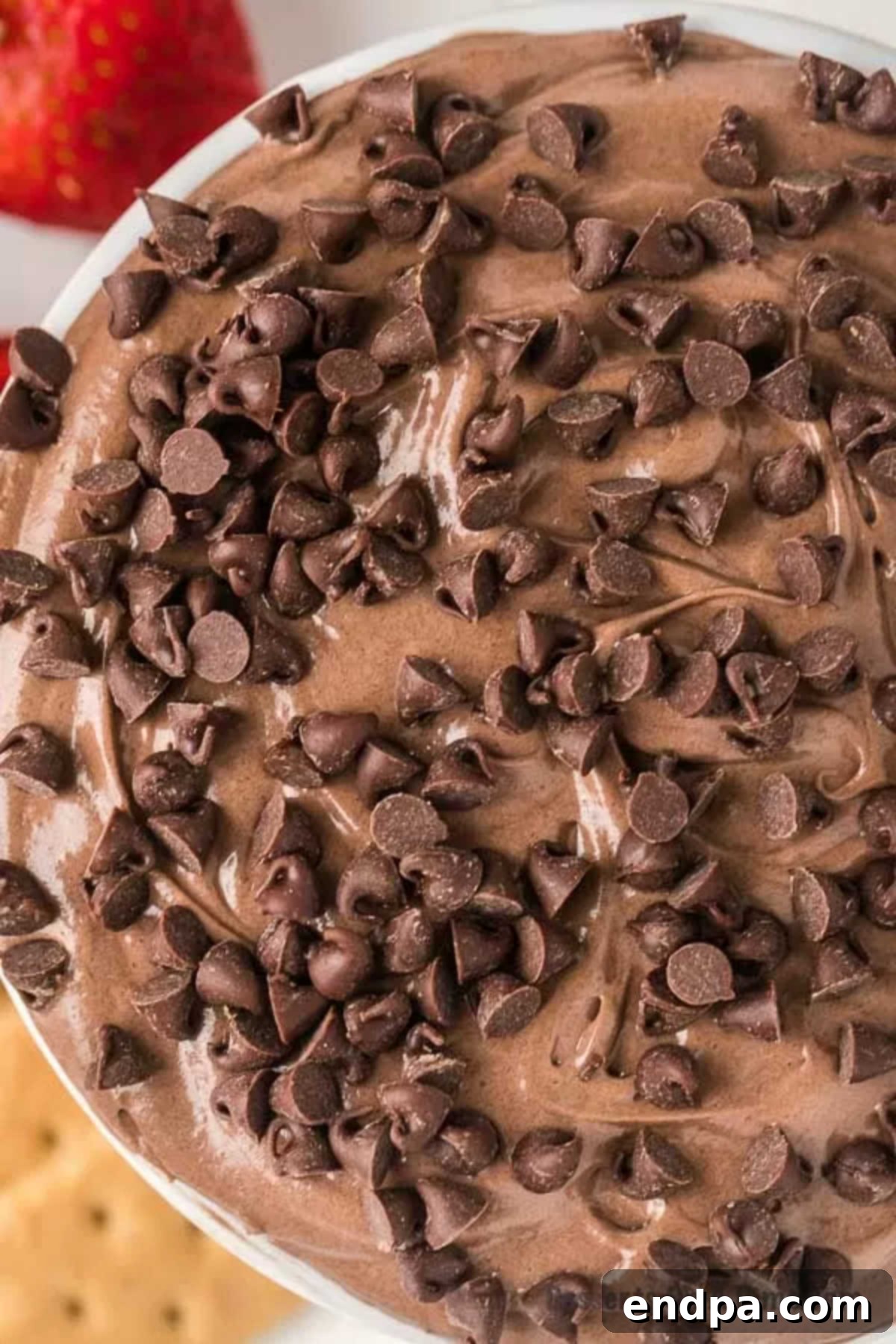 Decadent Brownie Dip 8 A bowl of rich, creamy brownie batter dip, ready to be served and enjoyed.