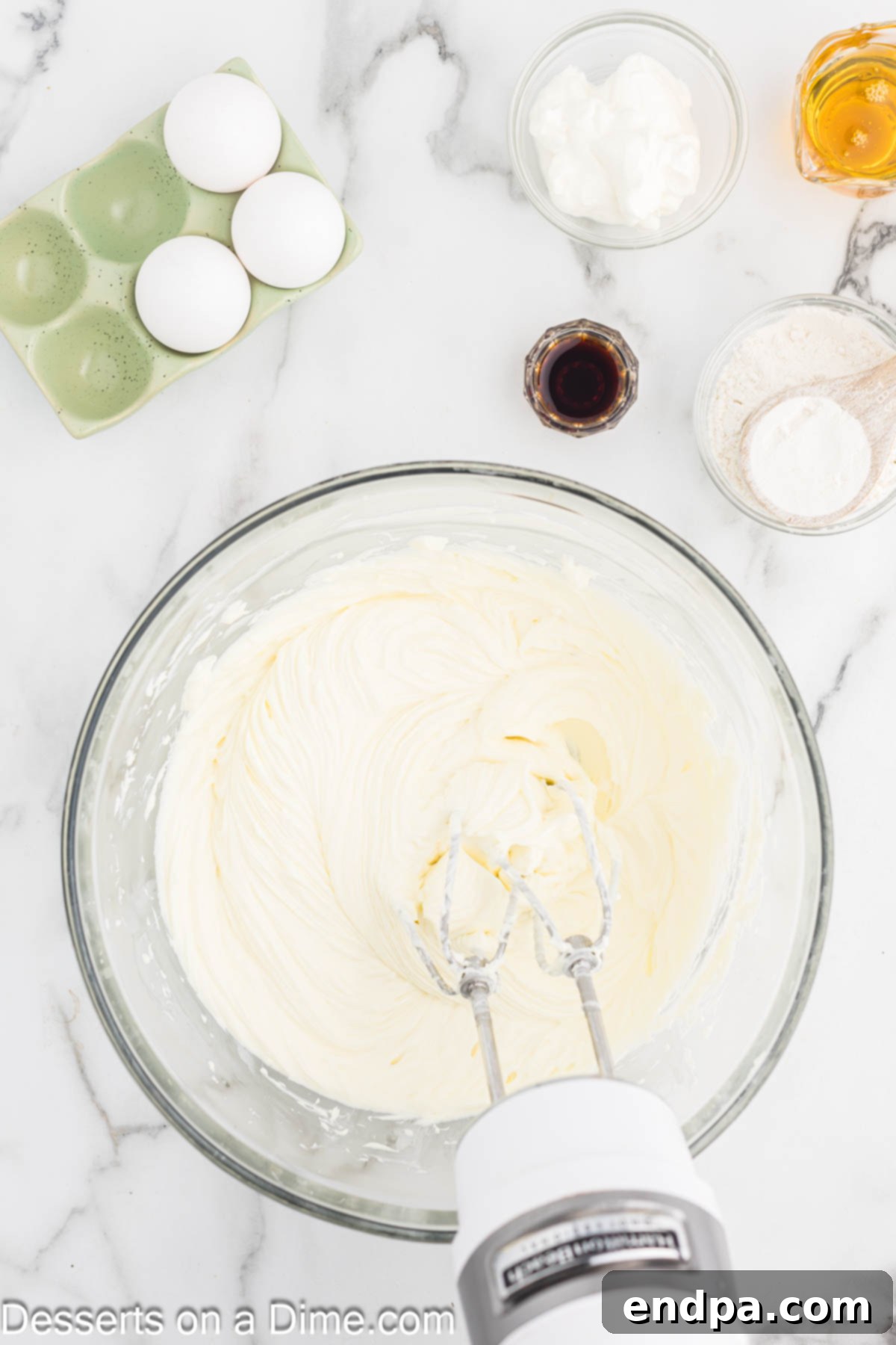 Golden Honey Swirl Cheesecake 5 Cream cheese and sugar beat until smooth.