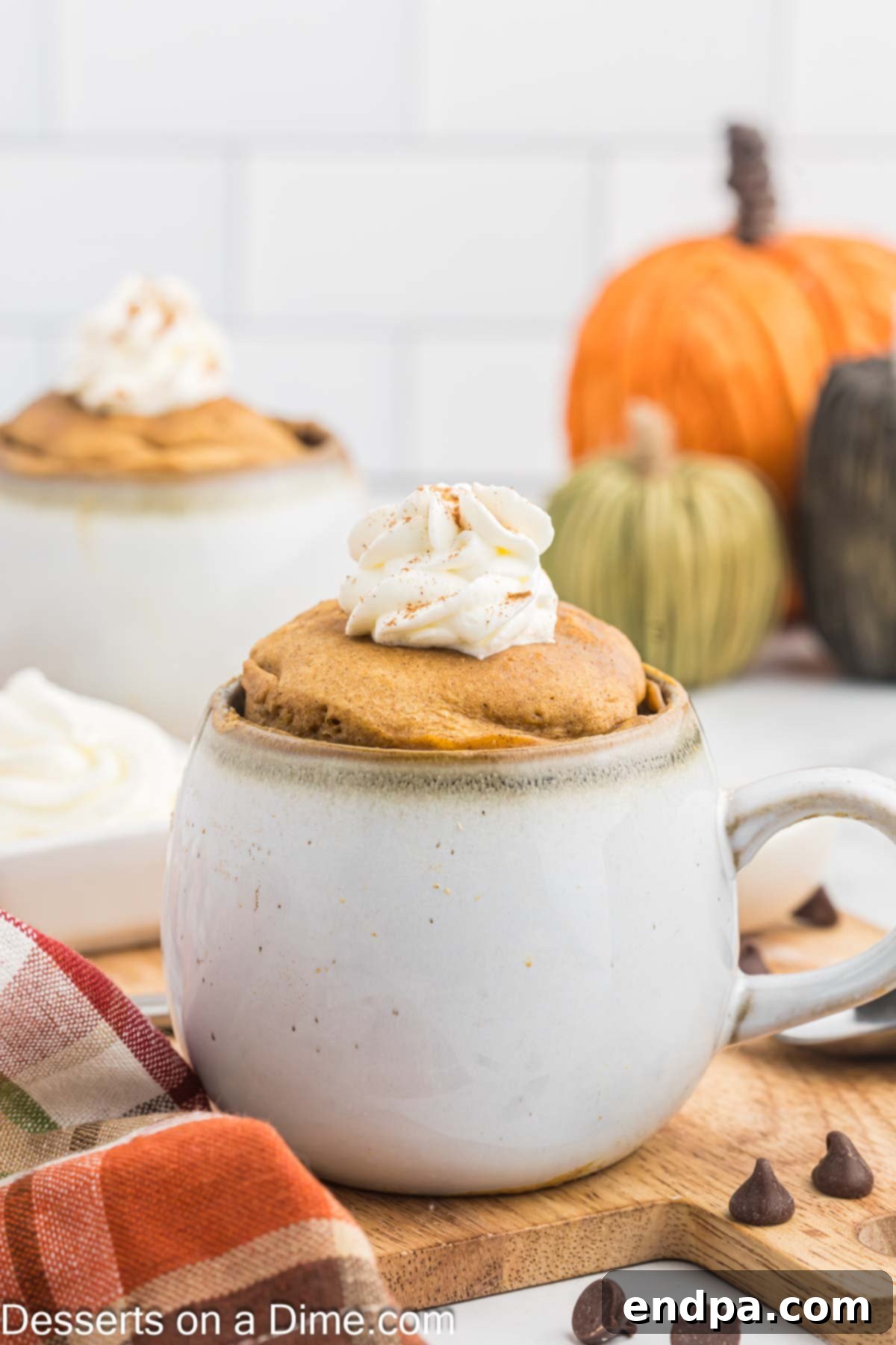 A beautifully presented pumpkin mug cake, warm and inviting.