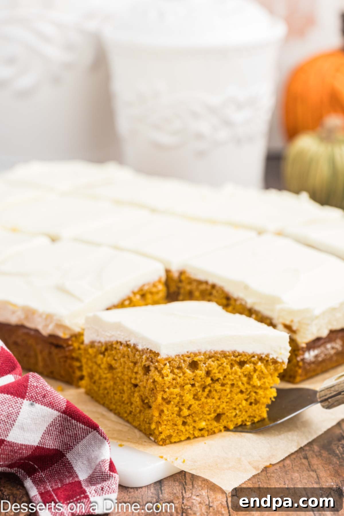 Individual Paula Deen Pumpkin Bars, perfectly cut into squares and showcased on a serving platter, highlighting their moist texture and creamy frosting.
