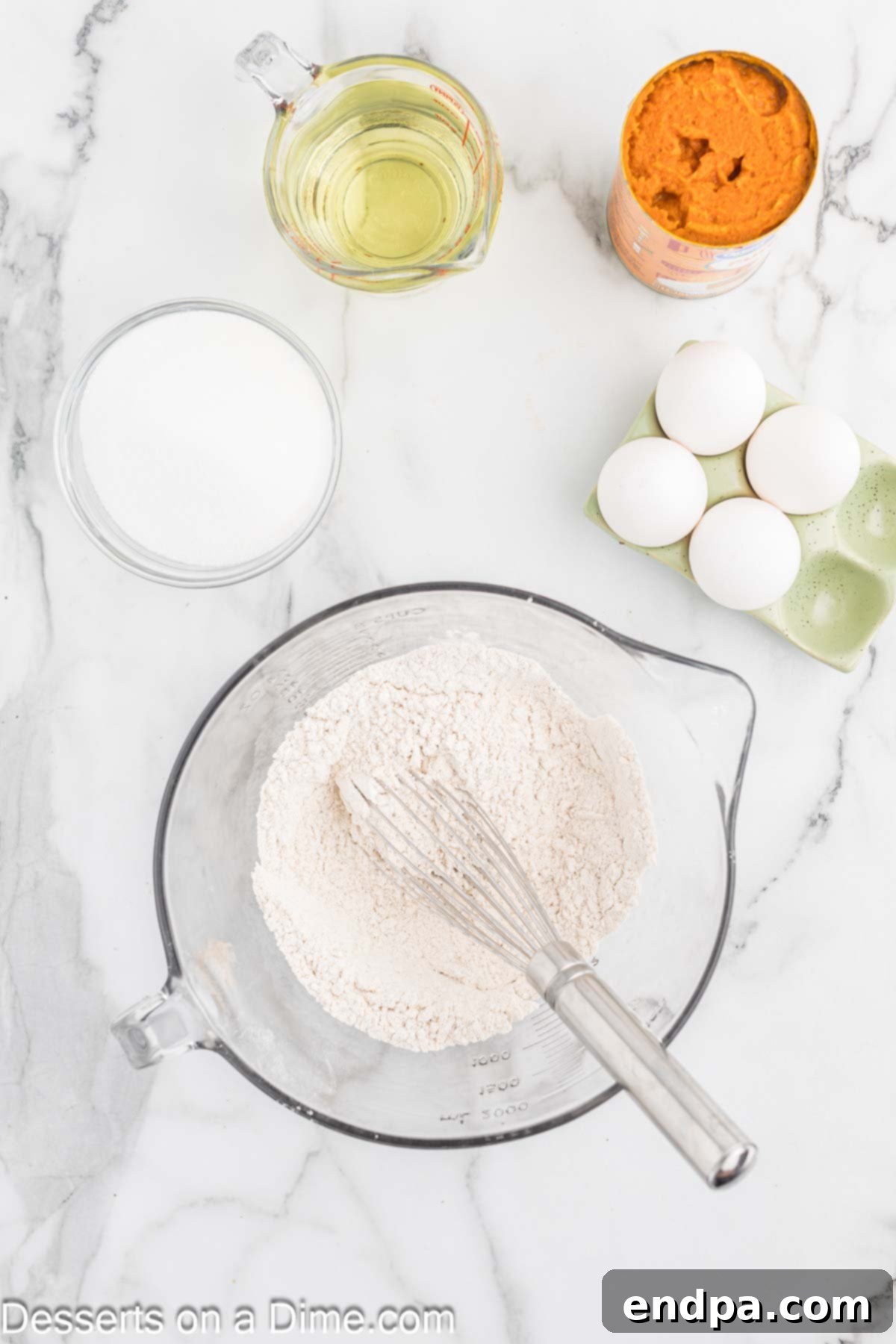 Dry ingredients for pumpkin bars, including flour, baking powder, baking soda, cinnamon, and salt, perfectly combined in a mixing bowl.