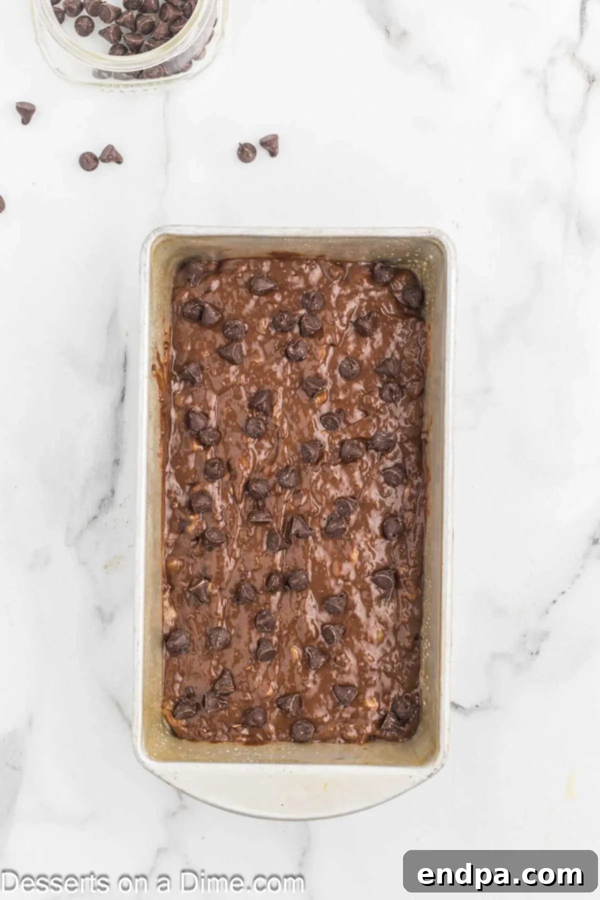 Ultimate Chocolate Banana Loaf 9 Additional chocolate chips sprinkled generously over the top of the banana bread batter.