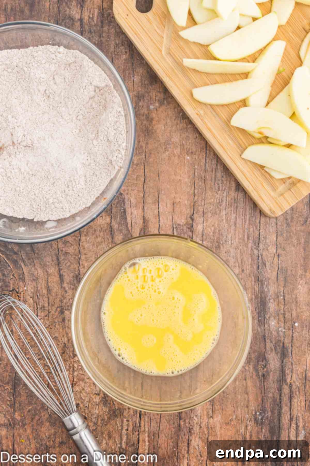 Mixing bowl with egg mixture and mixing bowl with cinnamon mixture. 
