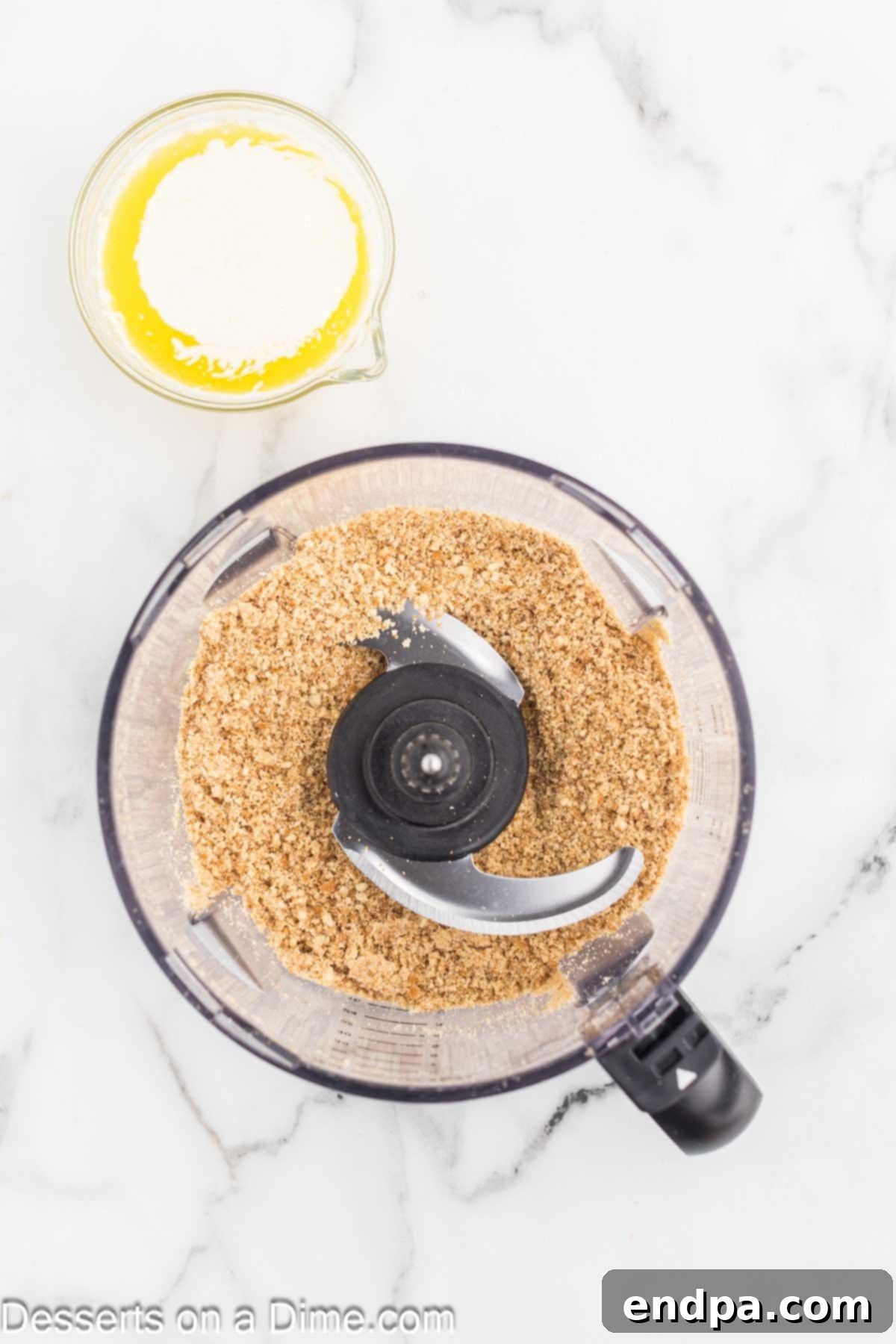Dreamy Banana Cheesecake Bars 4 Vanilla wafers being crushed in a food processor.