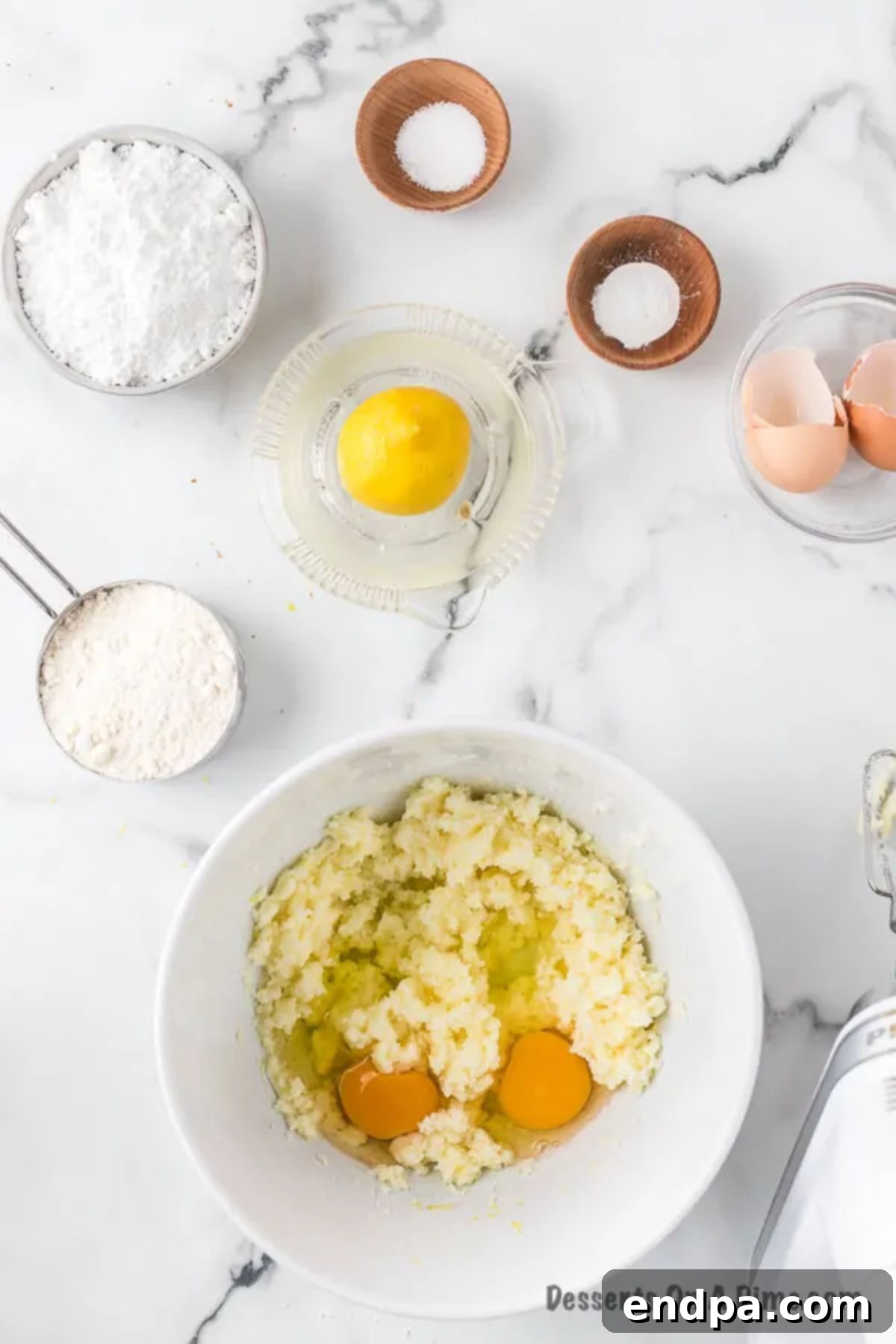 Eggs added to butter and sugar mixture.