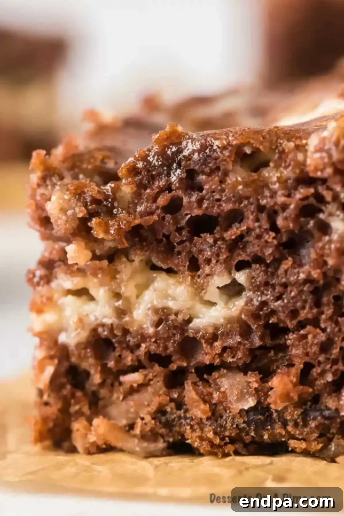 Decadent German Chocolate Cheesecake Bars 9 Bars stacked together.