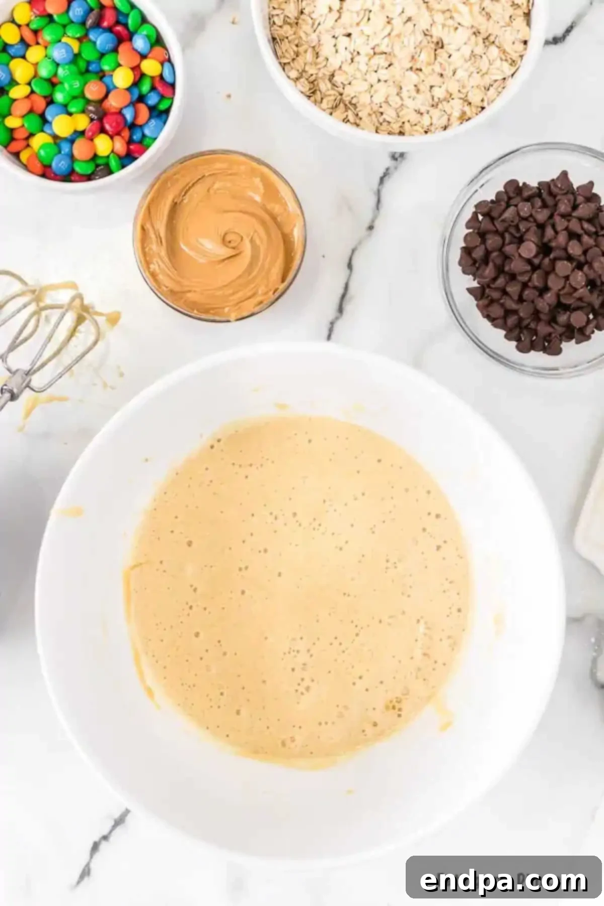 Bowl with eggs, vanilla, salt, and sugar.