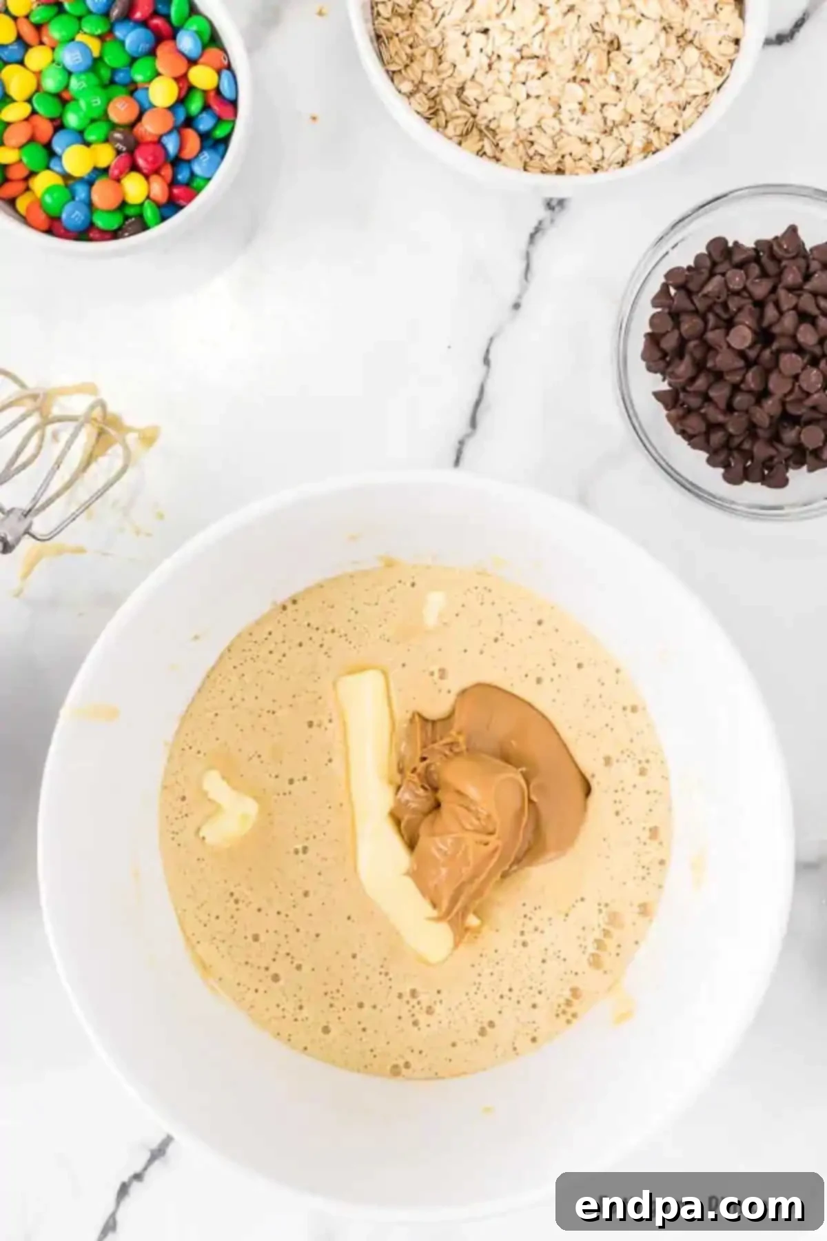 Butter and peanut butter added to mixing bowl.