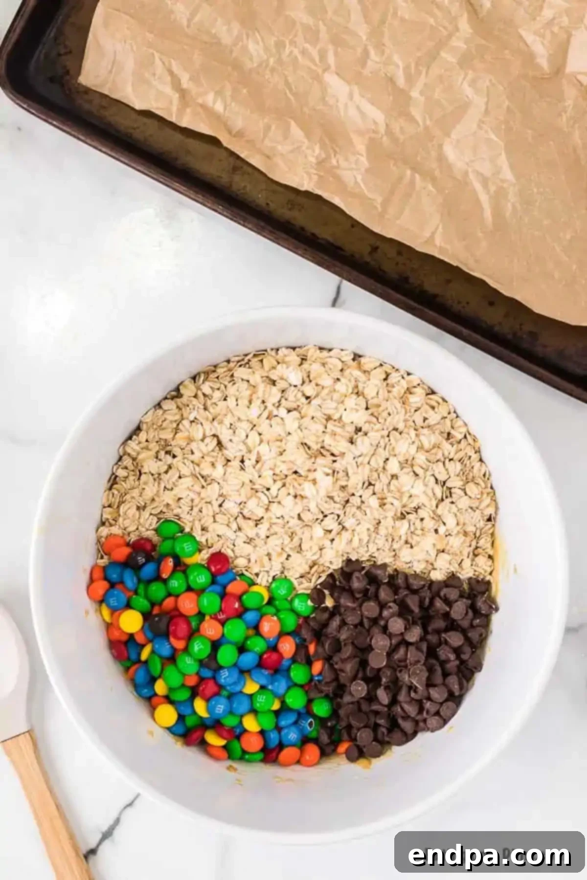 Mix-ins added to bowl and folded into mixture.