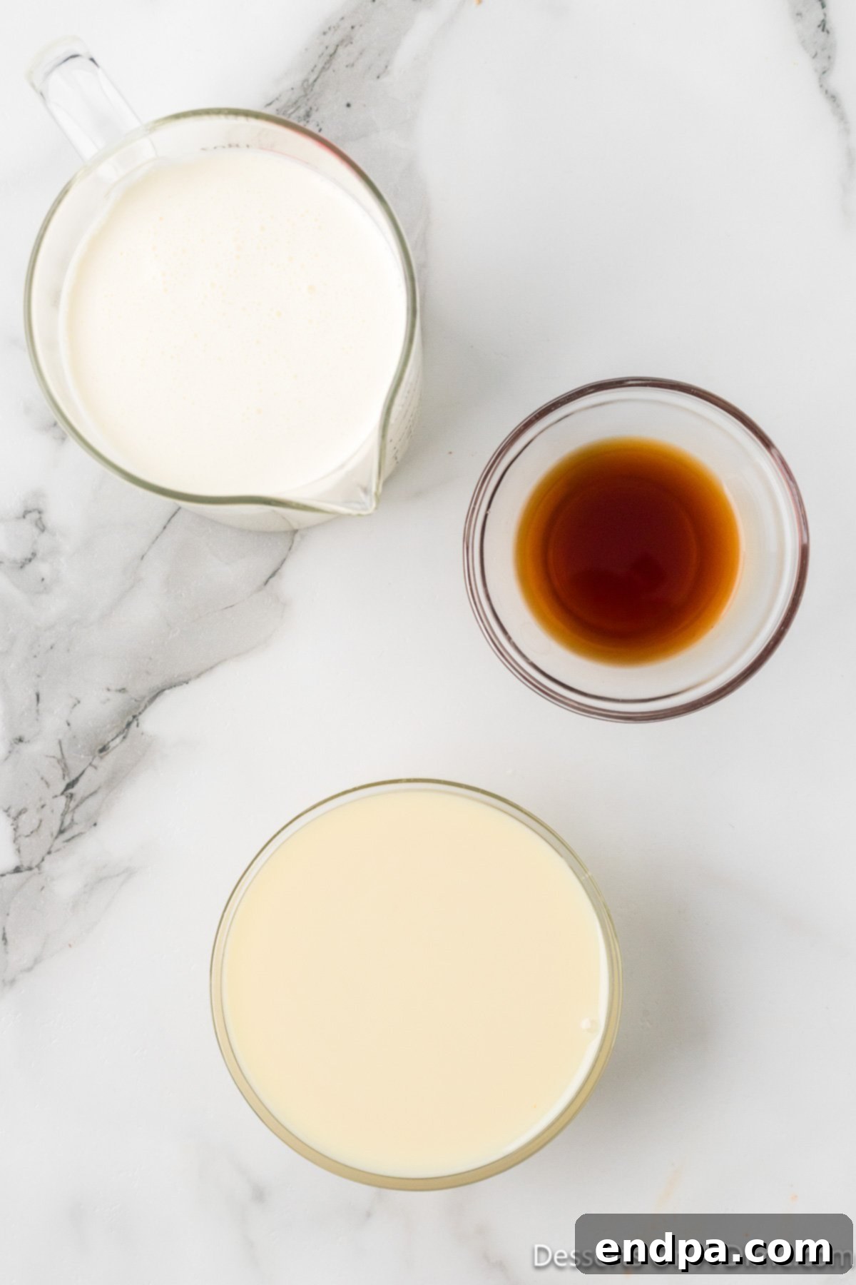 Ingredients for vanilla ice cream - sweetened condensed milk, vanilla, whipping cream. 