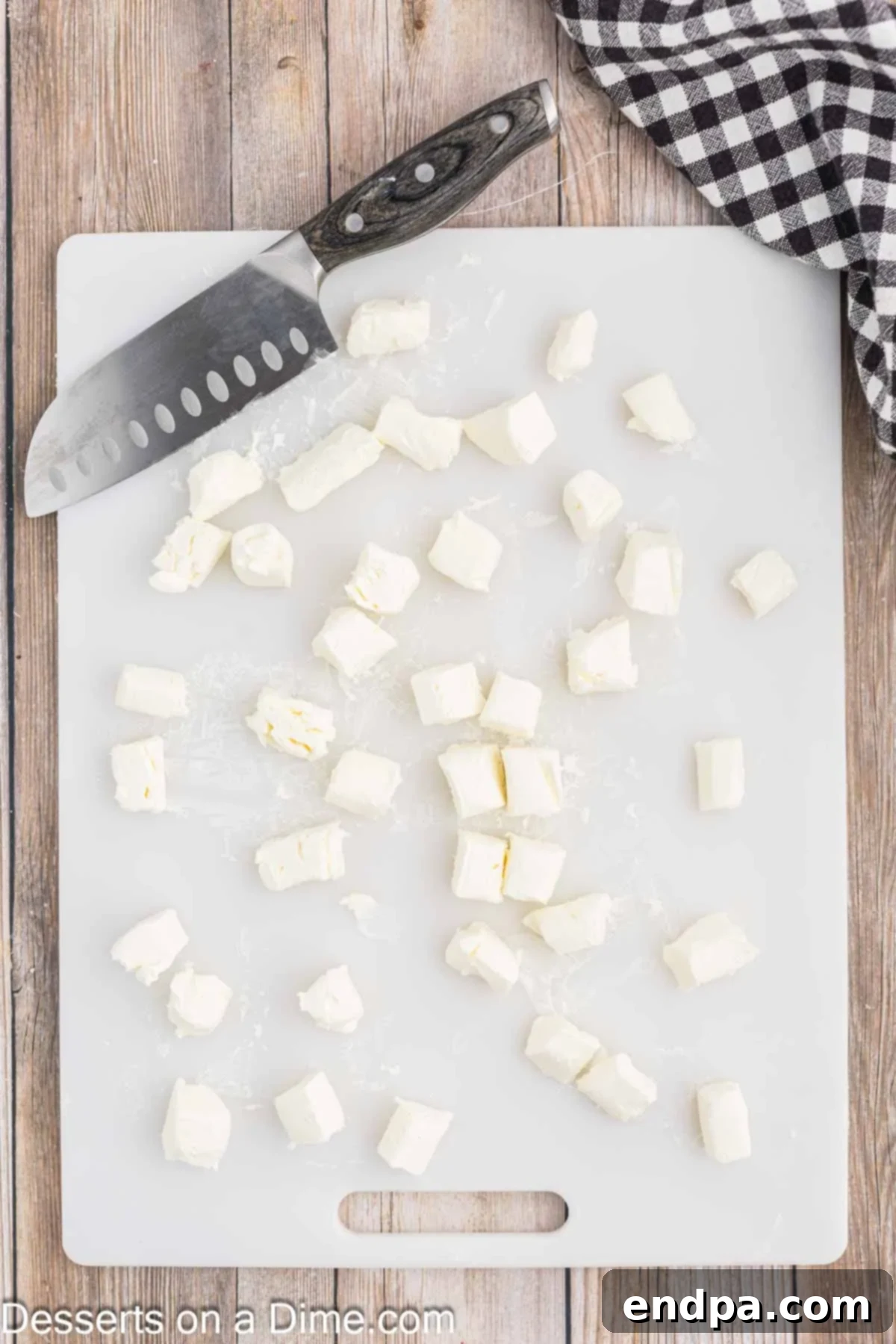 Effortless Ways to Soften Cream Cheese 5 Cream cheese cut into small, even cubes for microwave softening.