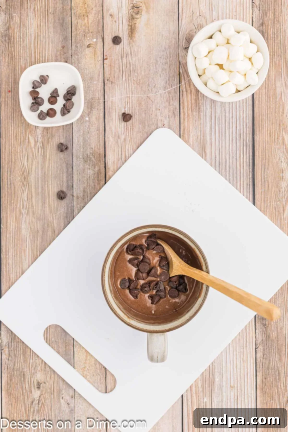 Rich Cocoa Mug Indulgence 5 Chocolate chips folded into mug.