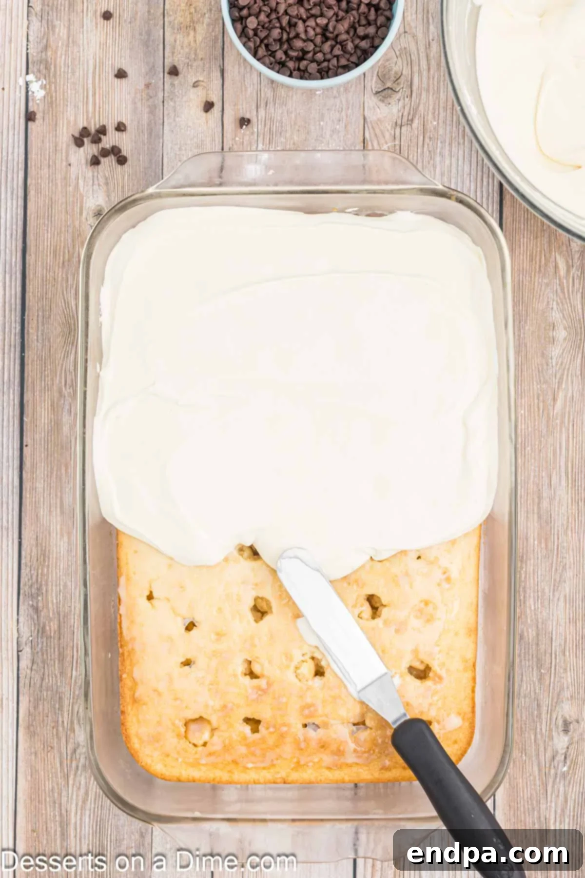 Cannoli frosting spread over cake.
