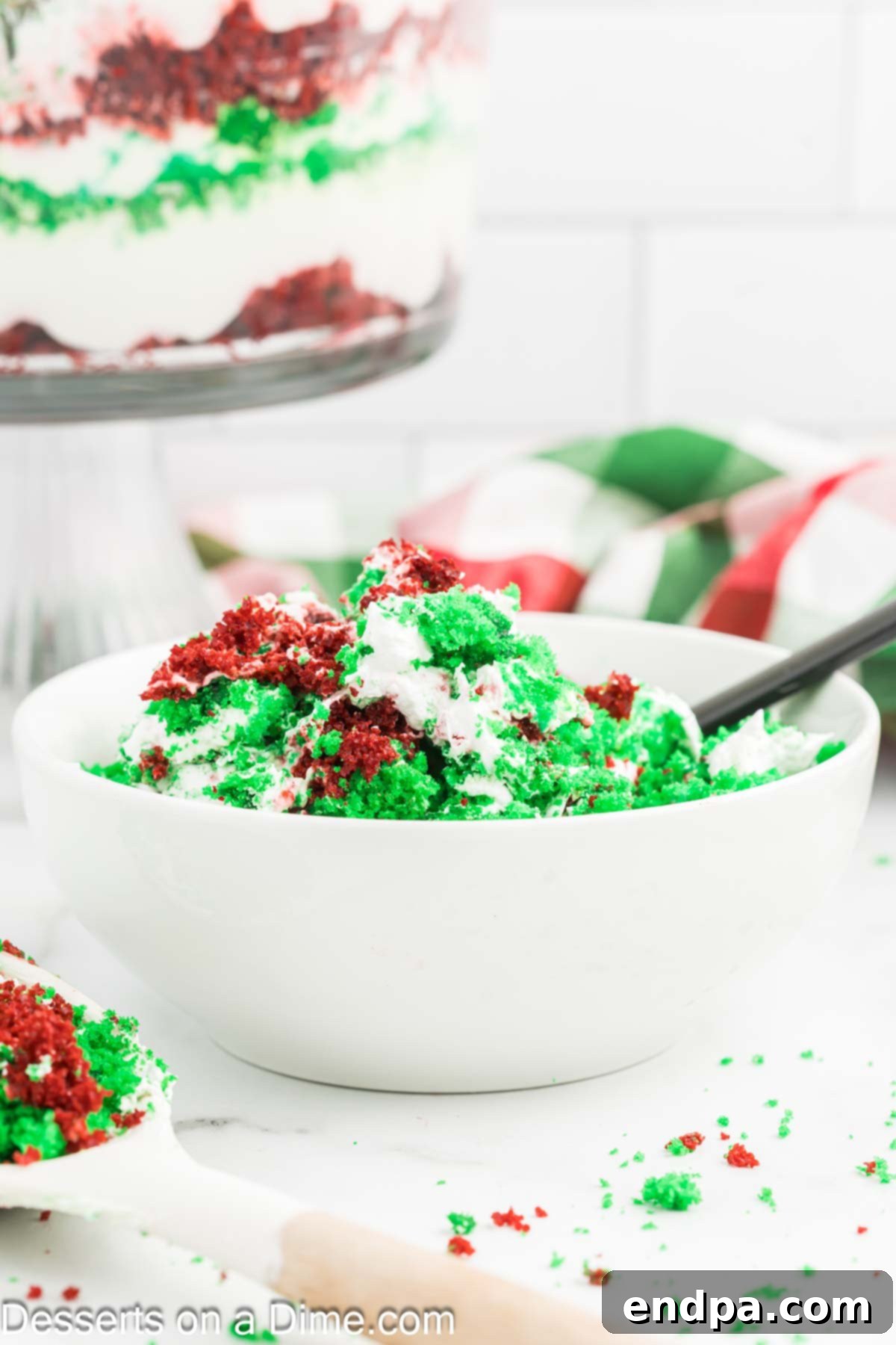 A single serving of Christmas Trifle presented in a clear bowl, showing all the beautiful layers.