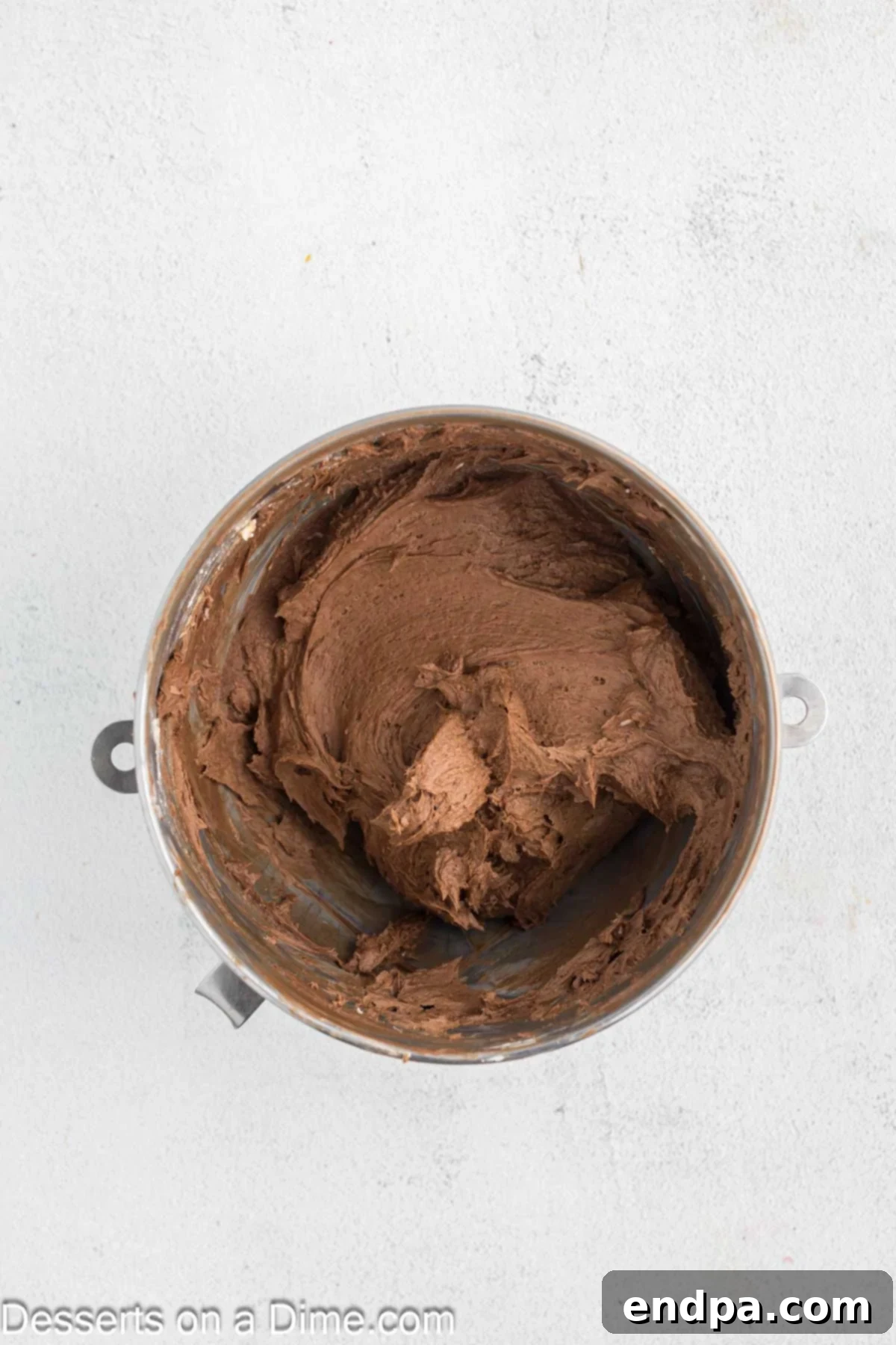 Festive Turkey Cake 8 Powdered sugar and cocoa powder added to butter and combined.