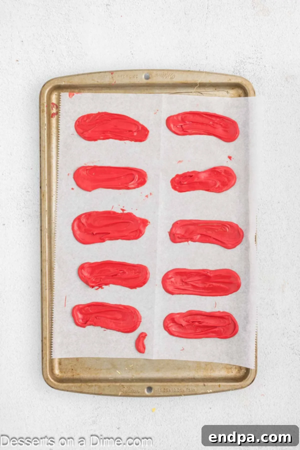 Festive Turkey Cake 10 Candy melts spread on baking sheet for feathers.