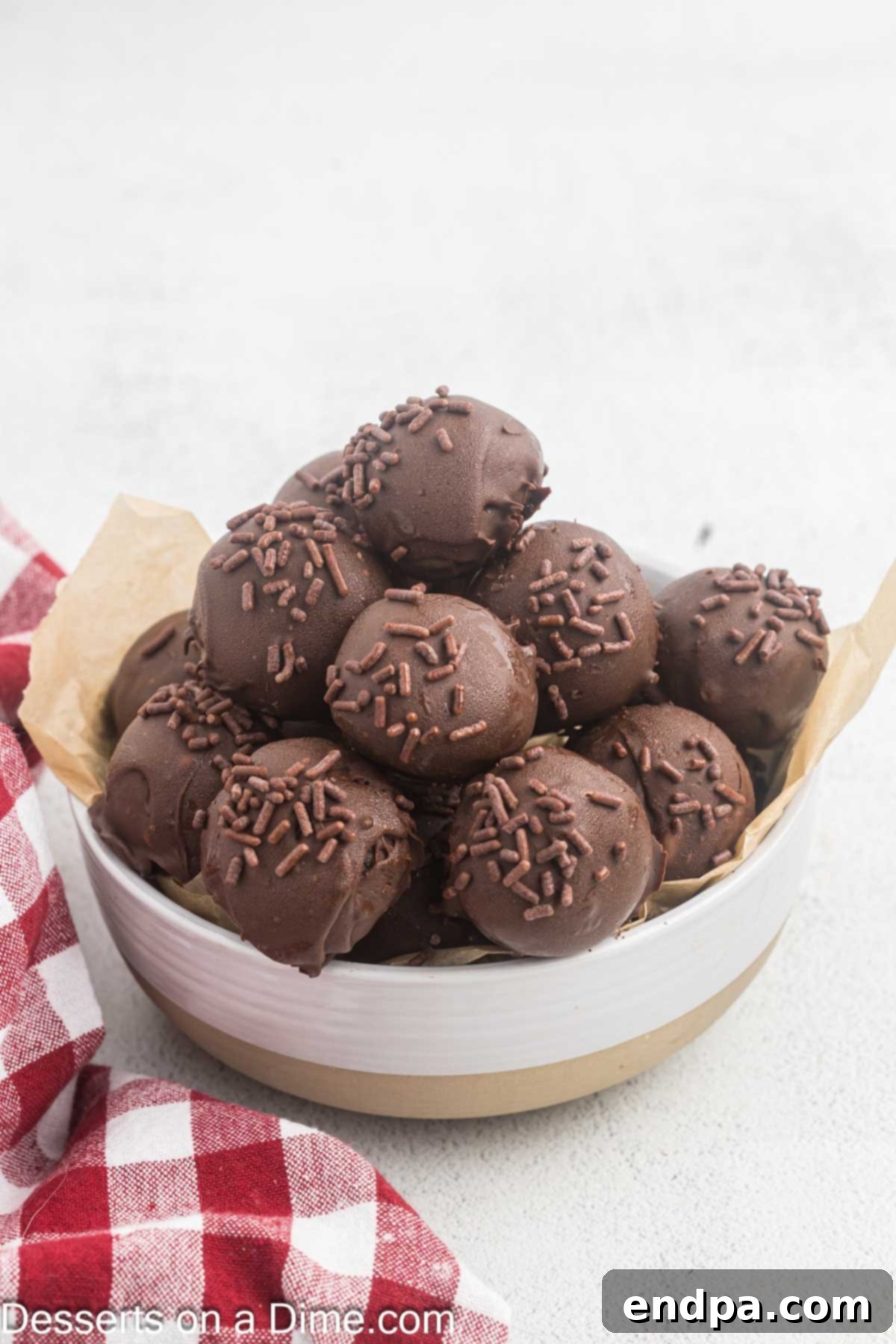 Fudgy Brownie Bonbons 2 Brownie truffles in a bowl.