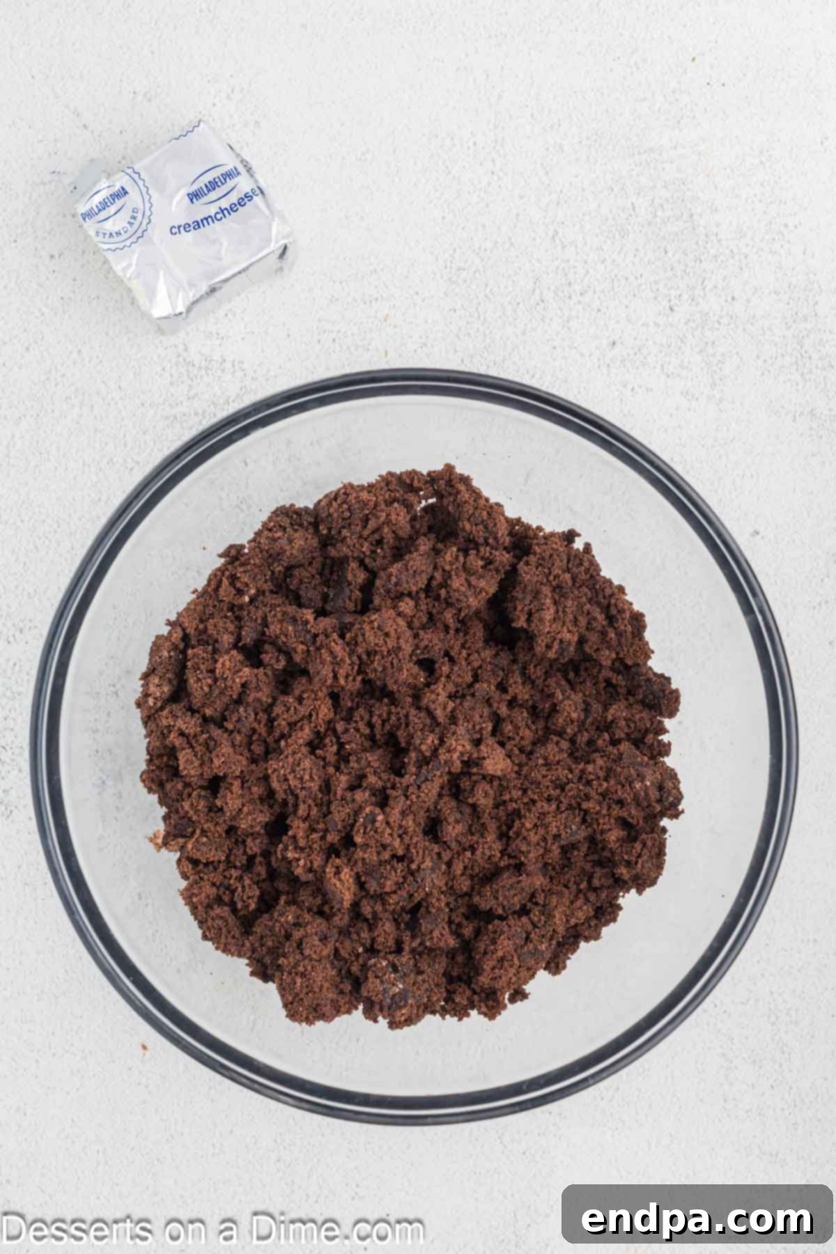 Fudgy Brownie Bonbons 4 Brownies crumbled in a bowl.