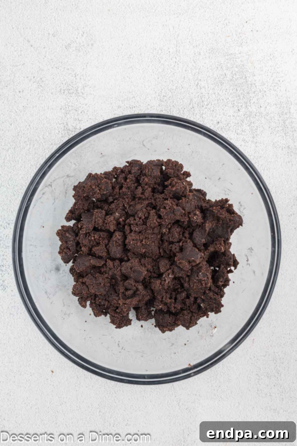 Fudgy Brownie Bonbons 5 Brownies combined with cream cheese in a mixing bowl.